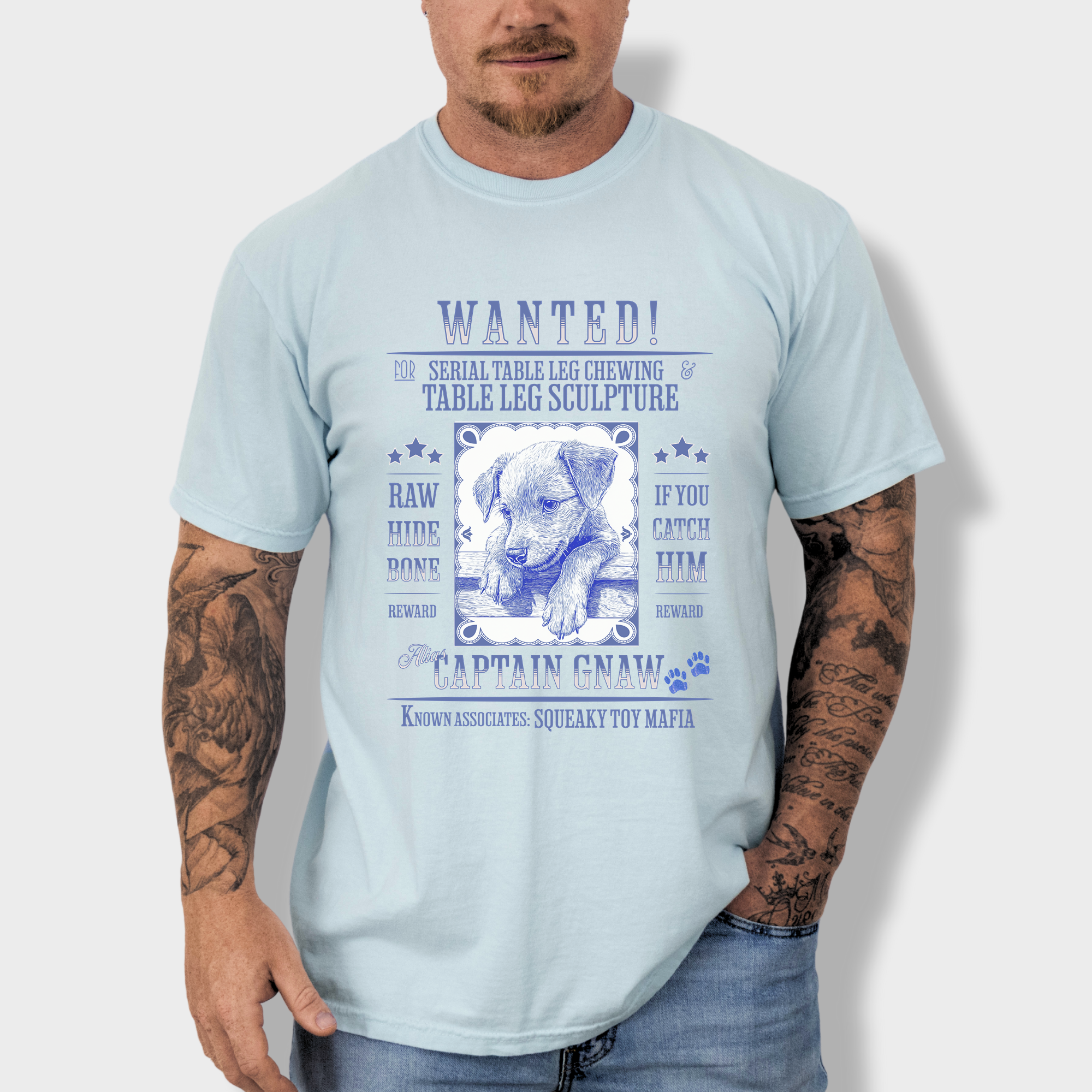 Vintage wanted poster T-shirt featuring a mischievous puppy chewing a shoe, wanted for destruction of property.