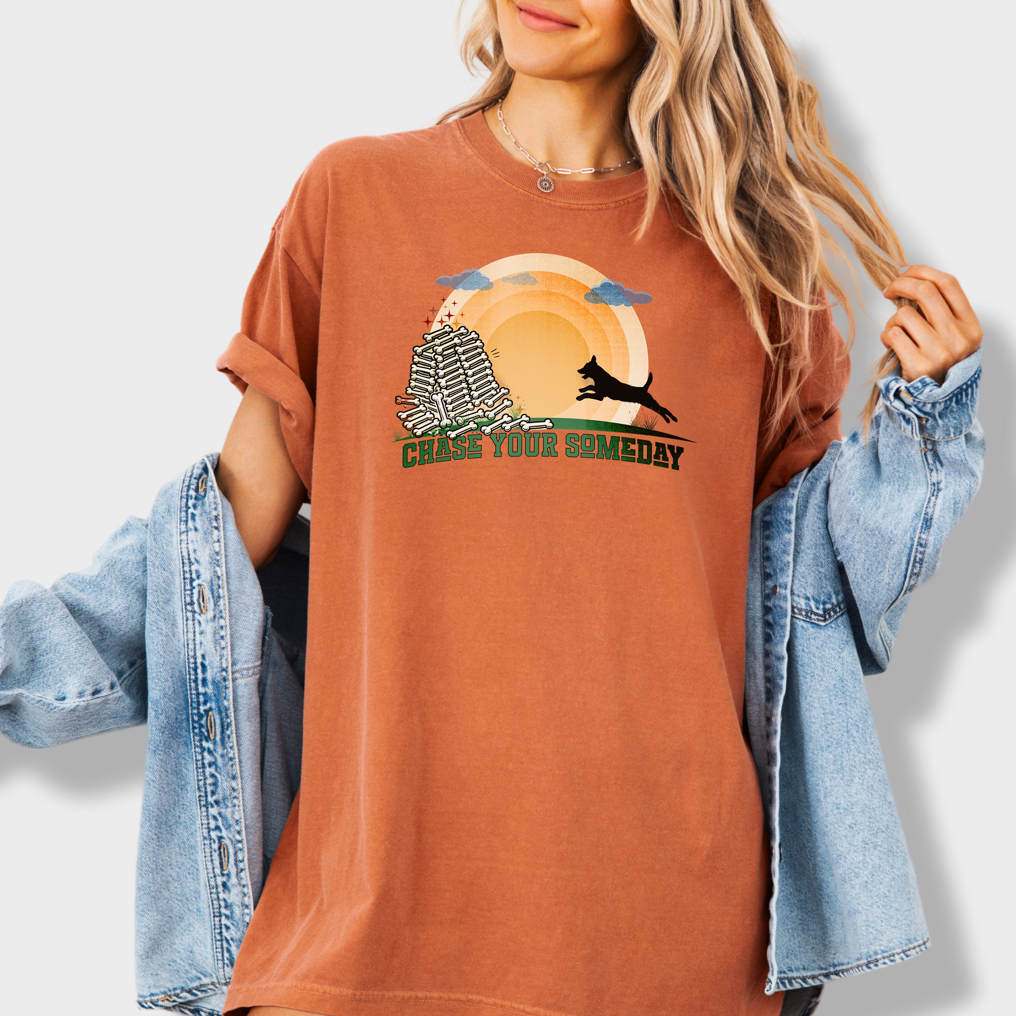 Motivational retro-style dog tee with a playful dog running towards success, symbolized by the sun and dog bones.