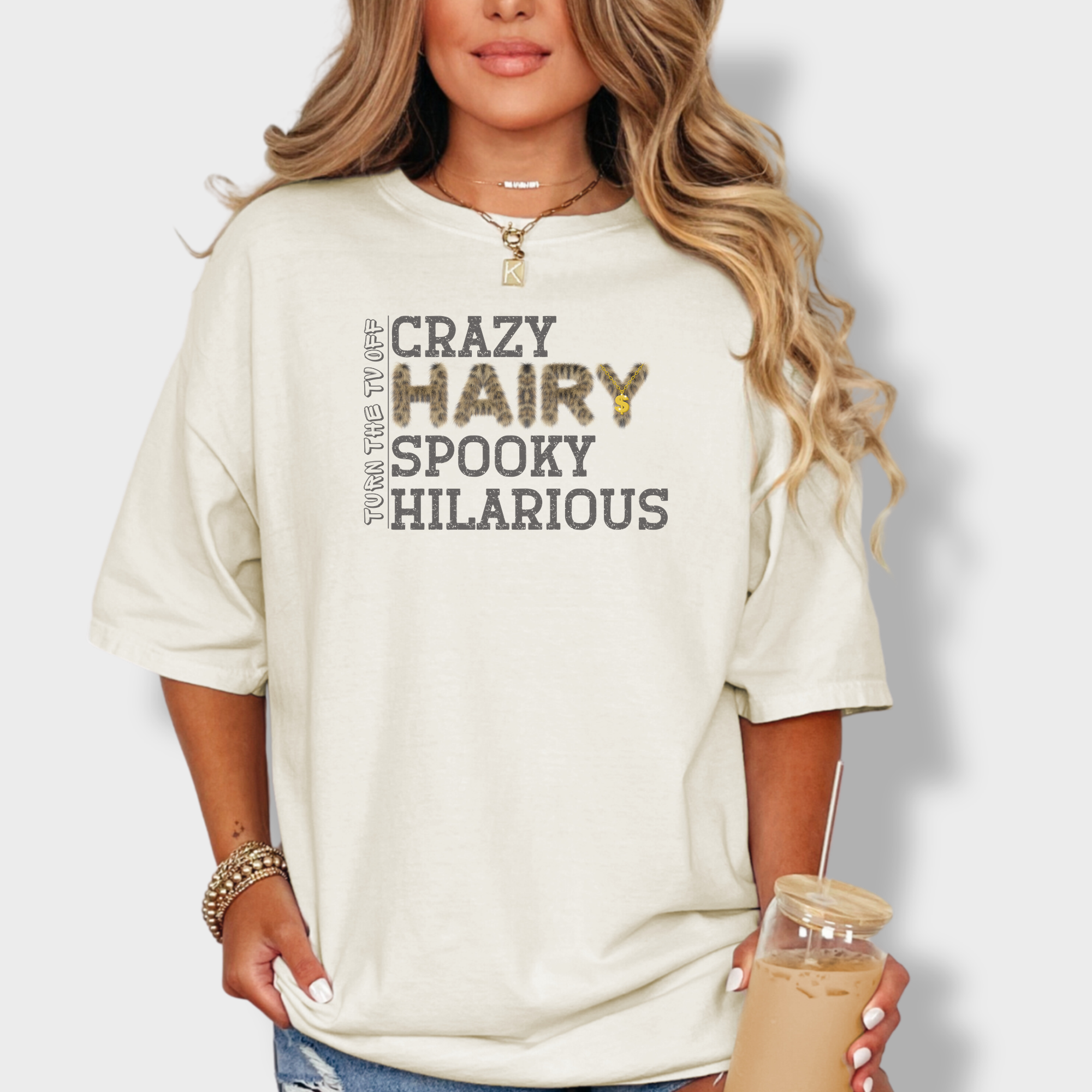 Playful graphic tee with bold, textured lettering spelling out 'Crazy Hairy Spooky Hilarious,' inspired by Kendrick Lamar’s 'Turn the TV Off'.