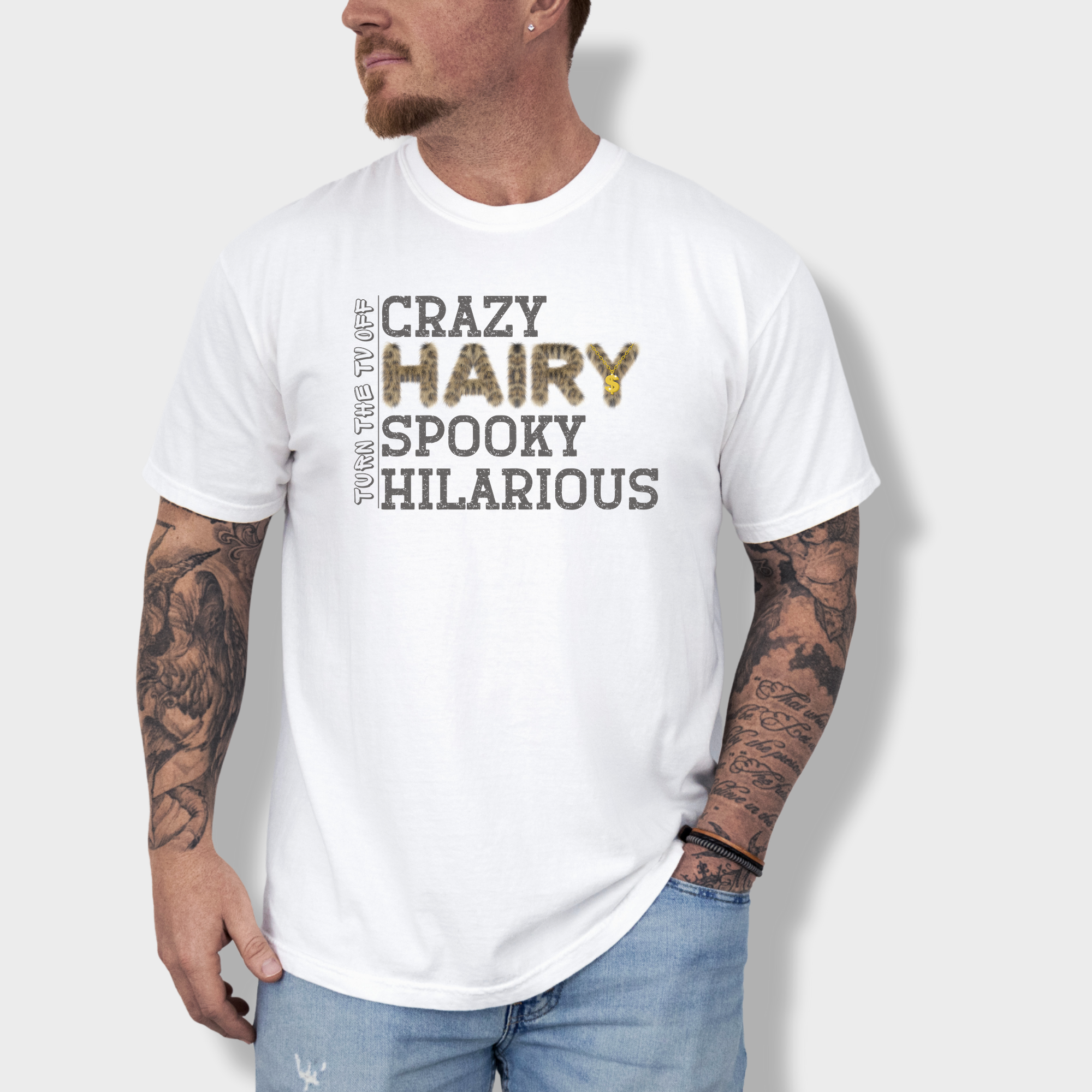 Funny hip-hop inspired T-shirt featuring the phrase 'Crazy Hairy Spooky Hilarious' in a fur-textured font with a gold chain detail.