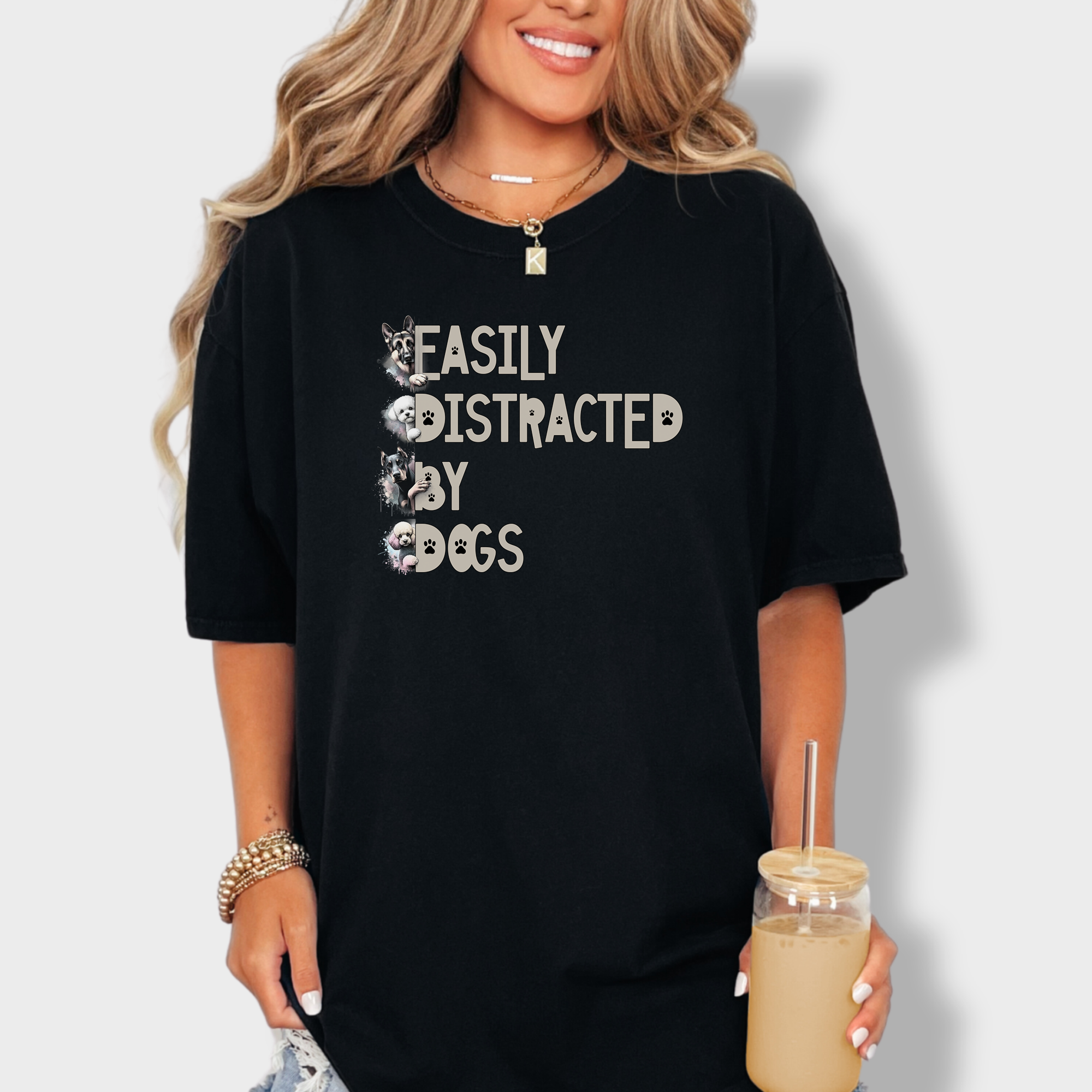 Funny pet lover’s tee with a vibrant design, featuring playful dog breeds surrounding the text 'Easily Distracted by Dogs'.