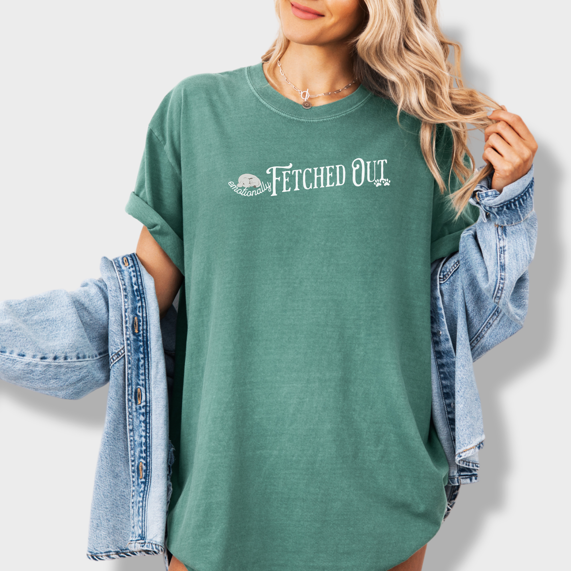 Trendy pet lover’s T-shirt featuring a clever wordplay on fetching and emotional exhaustion, perfect for dog enthusiasts.