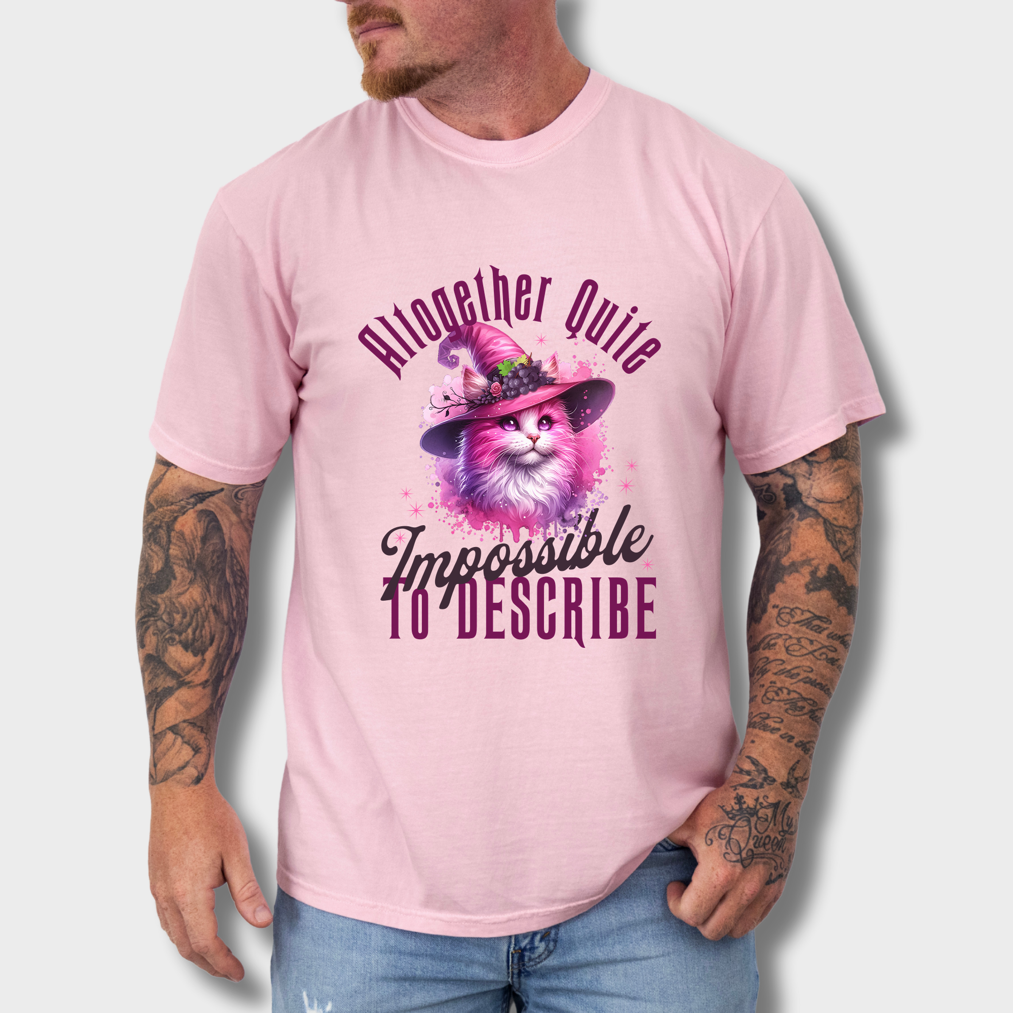 Elegant feline witch T-shirt featuring a pink watercolor cat in a mystical hat, with a poetic phrase from Wicked.