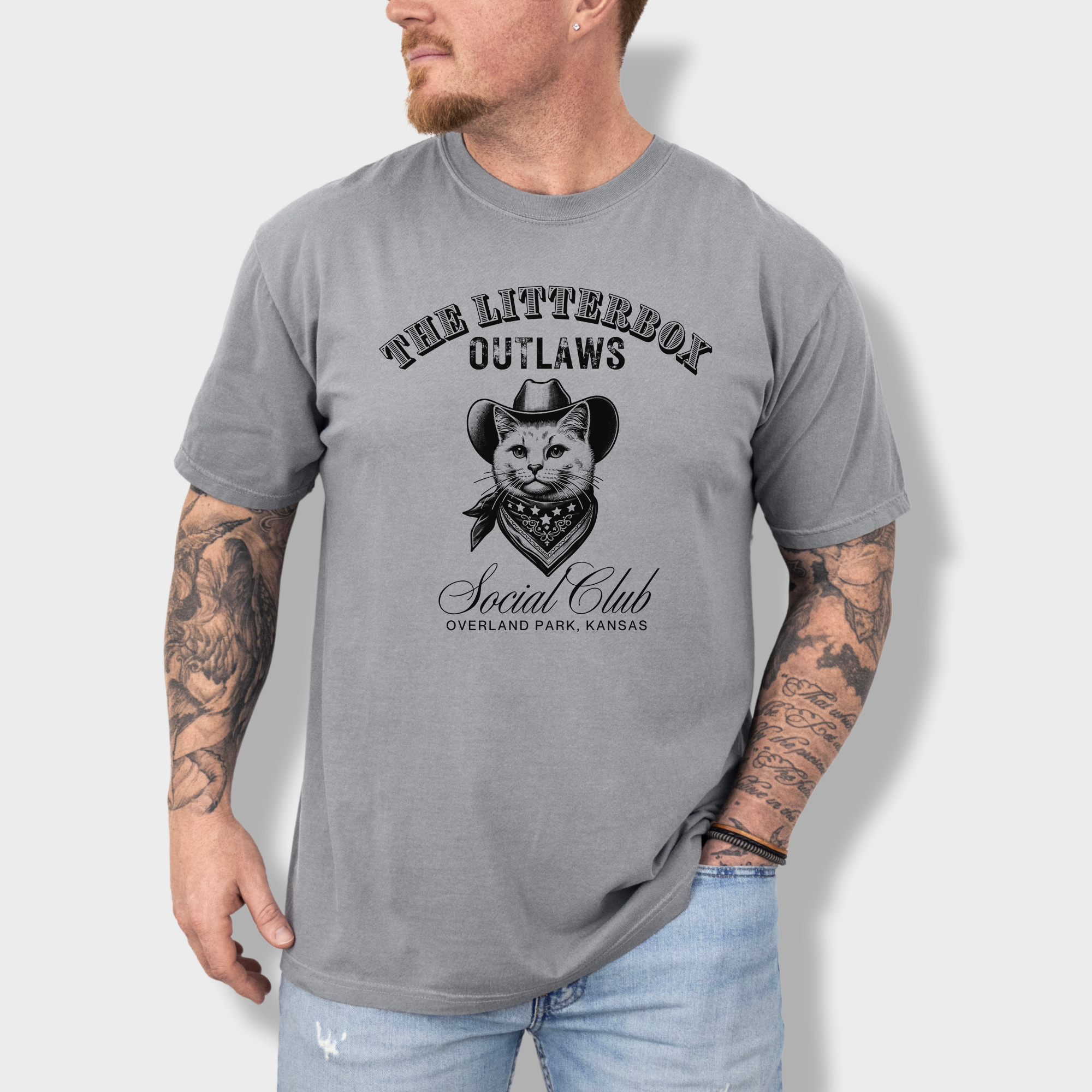Funny outlaw cat graphic tee with a cowboy-hat-wearing feline and a customizable 'Litterbox Outlaws Social Club' location.