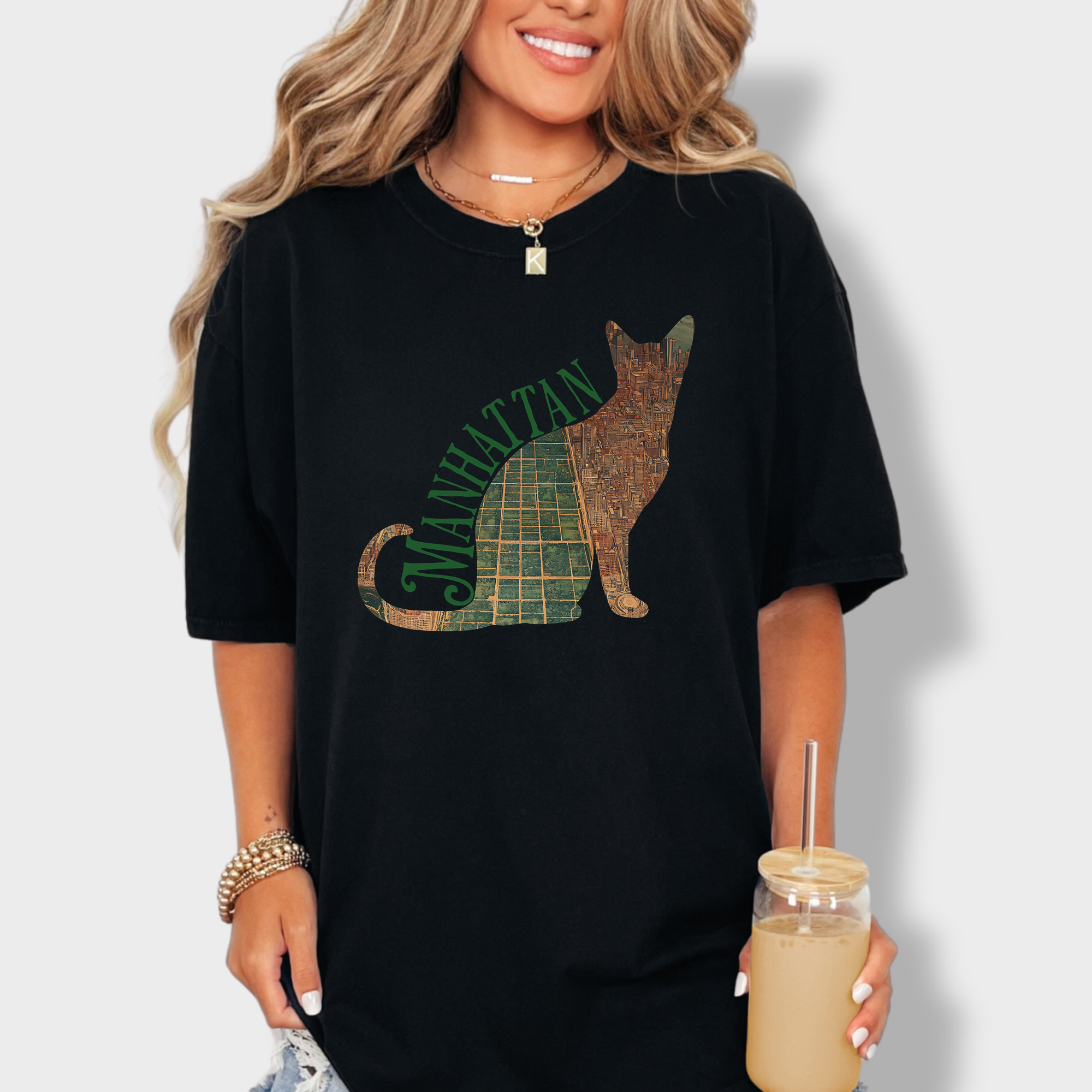 Artistic Manhattan-themed T-shirt with a satellite map of New York City bordered by a cat outline, perfect for cat lovers and city dwellers.