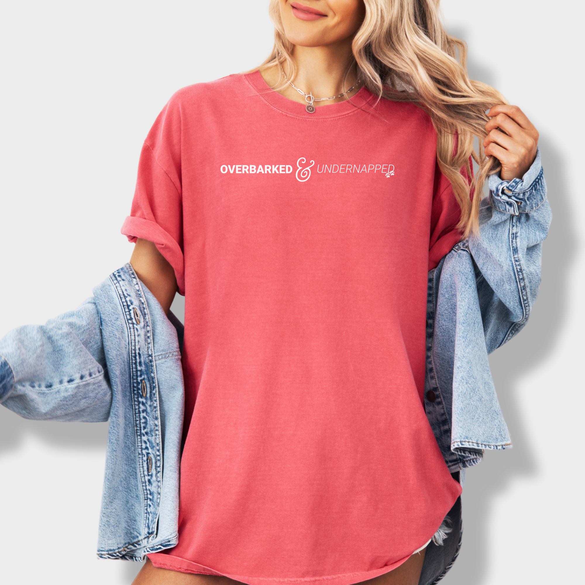 Minimalist pet parent tee with bold text reading 'Overbarked & Undernapped,' perfect for sleep-deprived dog lovers.