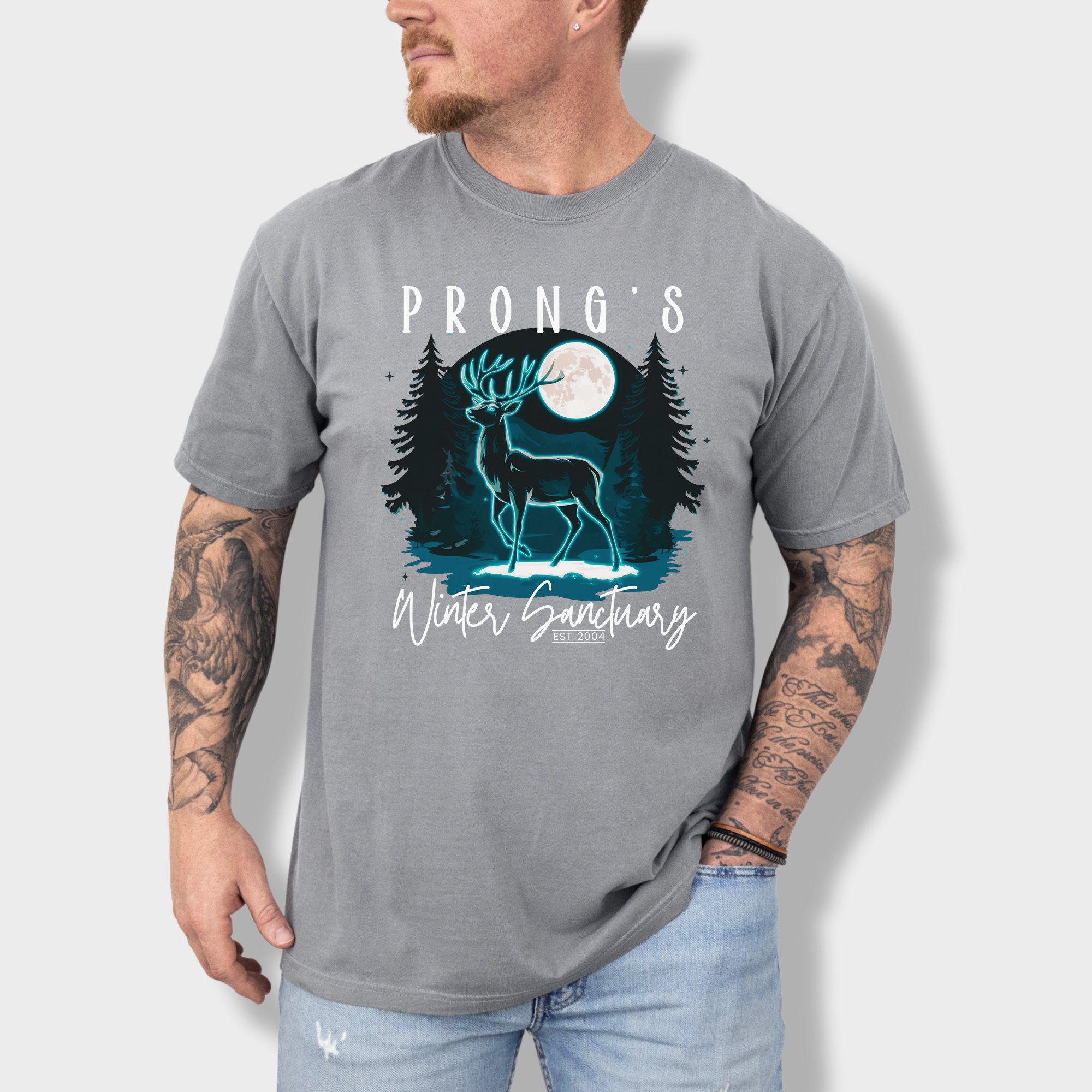Mystical wildlife-inspired T-shirt with a serene deer in a snowy forest, reflecting on a pond beneath a full moon.