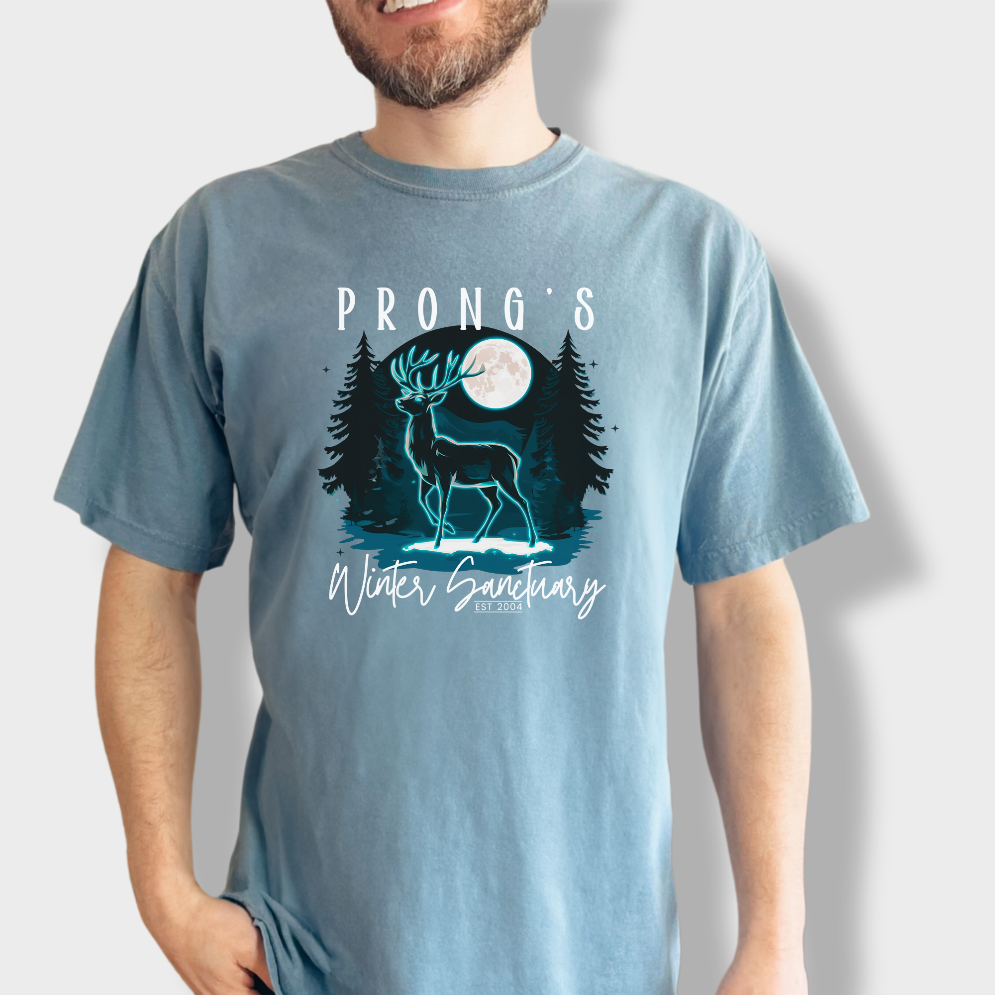 Magical deer silhouette in a moonlit forest, standing by a pond with the text 'Prong's Winter Sanctuary EST 2004,' inspired by Harry Potter.