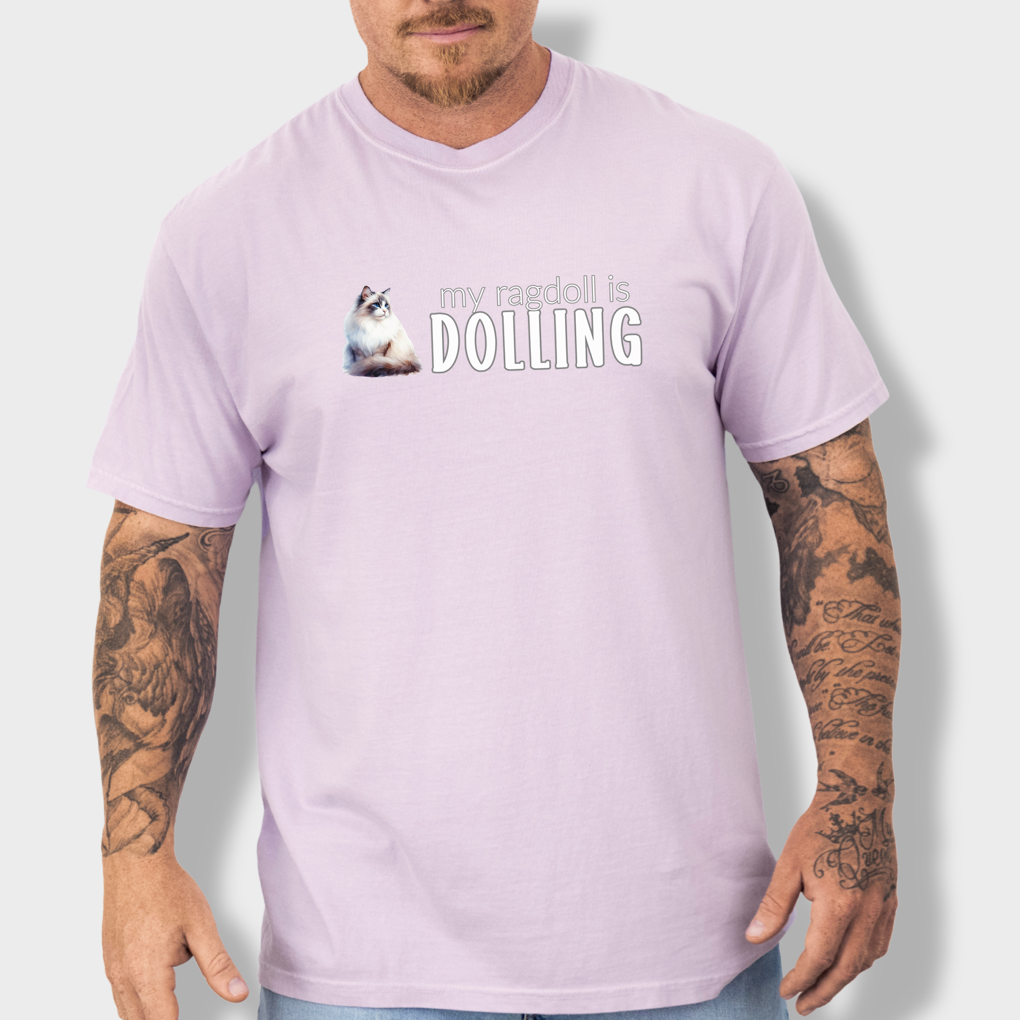 Watercolor Ragdoll cat T-shirt with the fun phrase 'My Ragdoll is Dolling,' printed on soft 100% cotton.