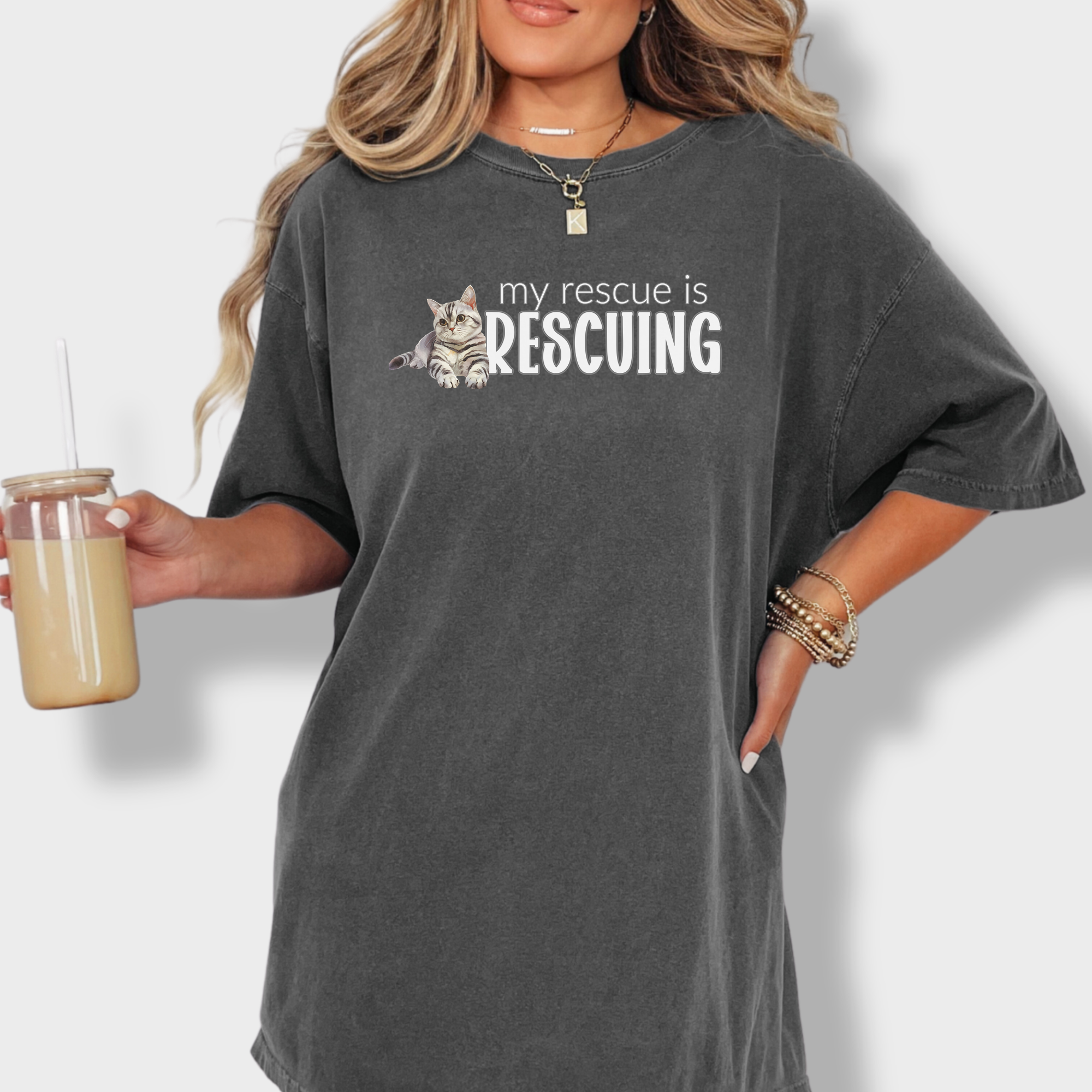 Artistic rescue cat lover’s tee featuring a dreamy watercolor design and uplifting text celebrating adopted pets.