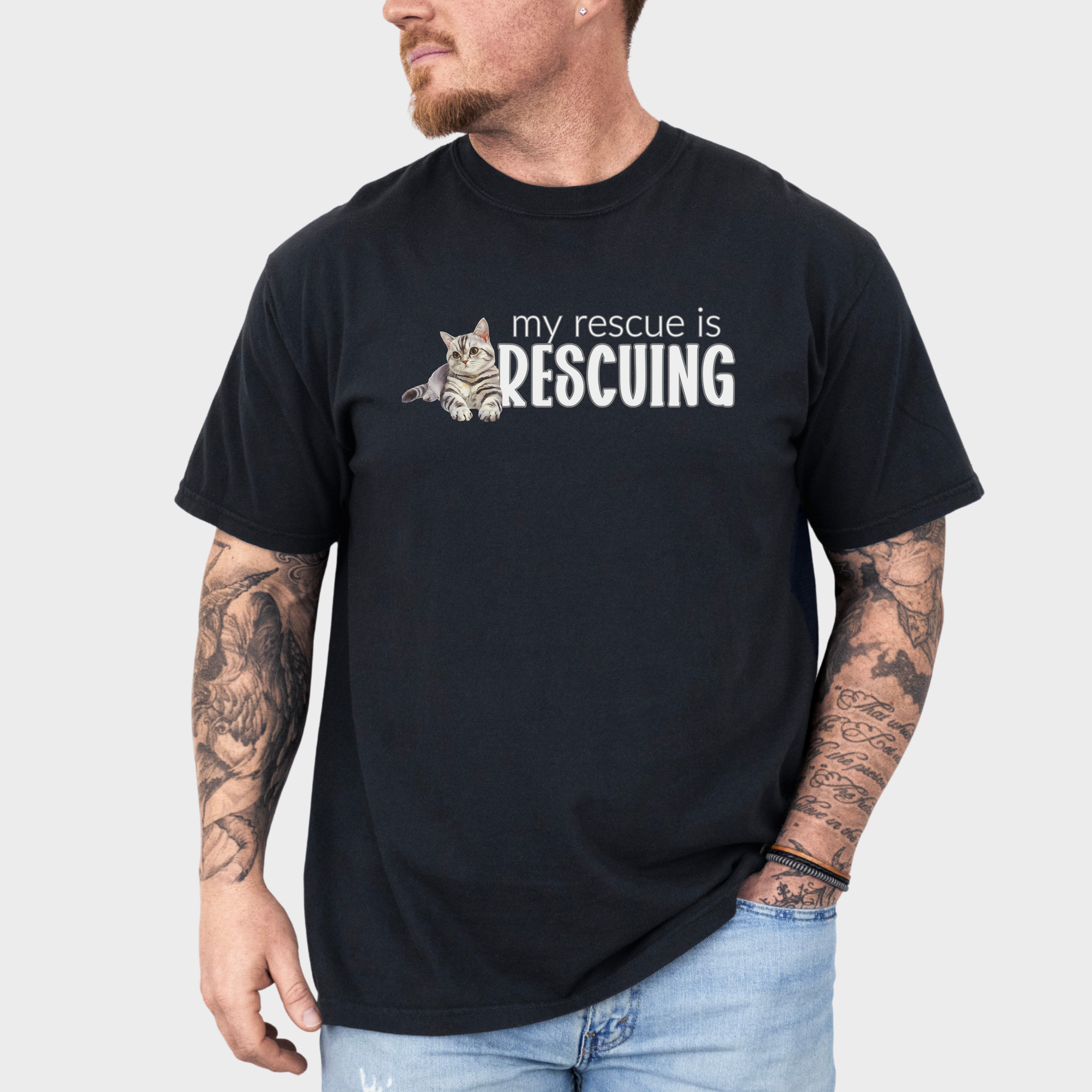 Watercolor rescue cat T-shirt with the heartfelt phrase 'My Rescue is Rescuing,' printed on soft 100% cotton.