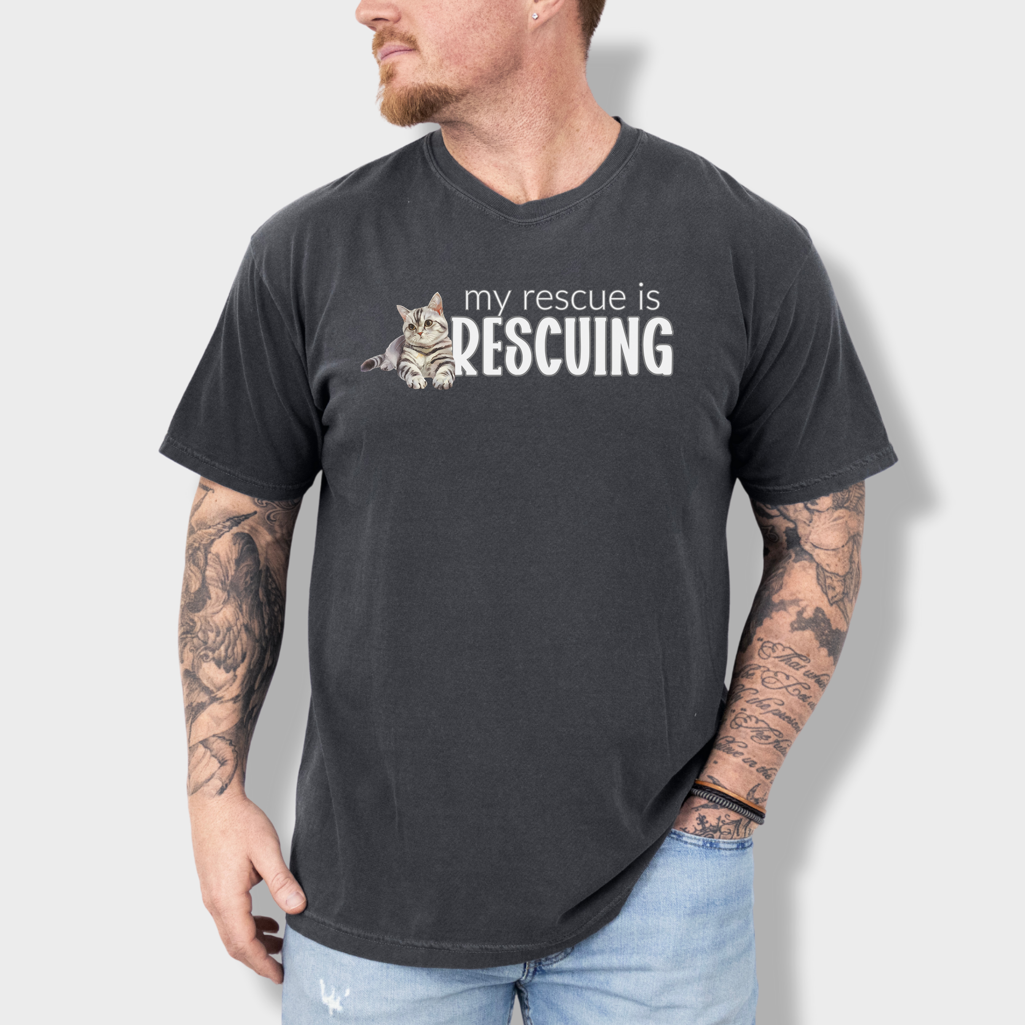 Retro-inspired rescue cat T-shirt with a unique watercolor print and the phrase 'My Rescue is Rescuing' in stylish lettering.