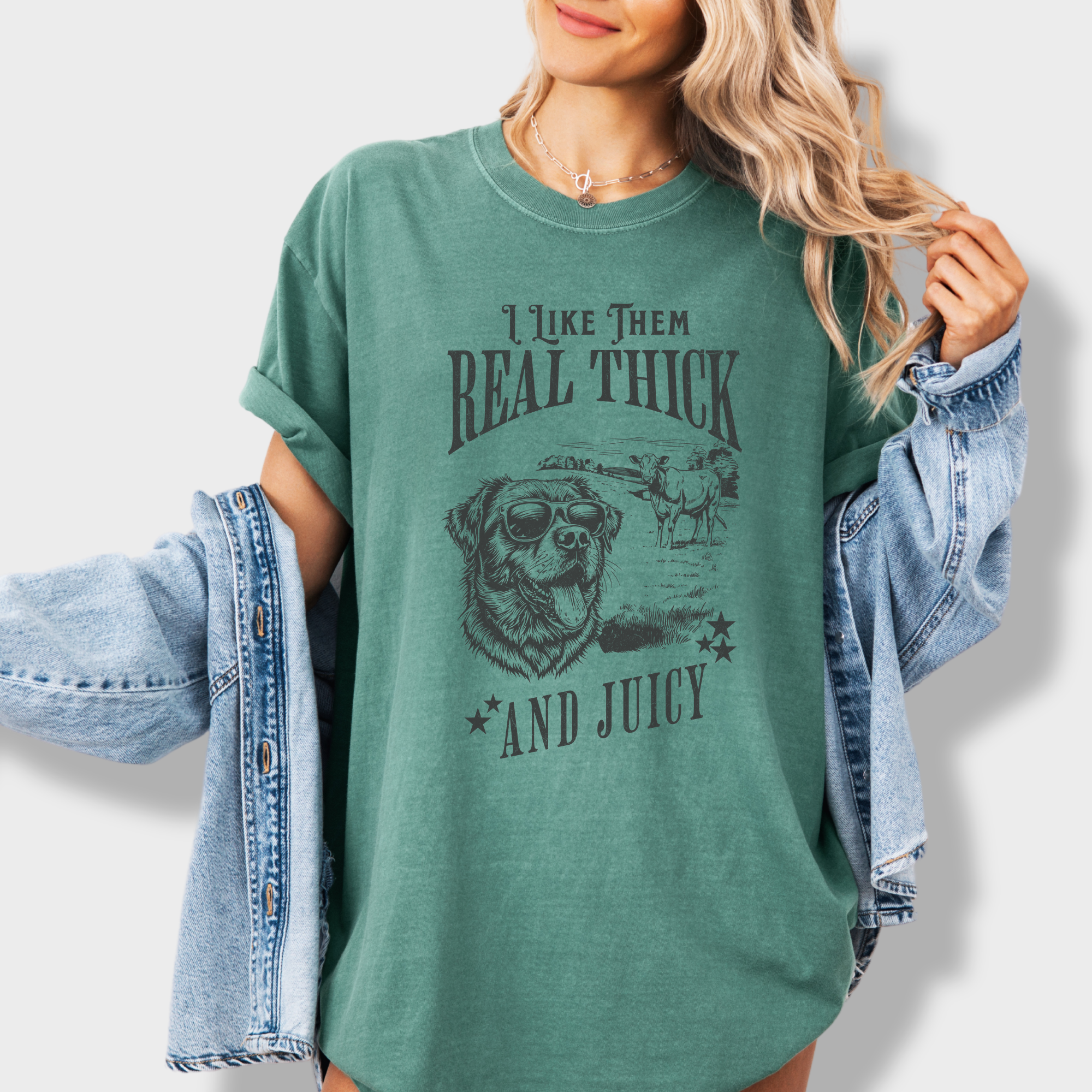 Soft cotton T-shirt featuring a humorous dog and cow design with the text 'I like them real thick and juicy,' inspired by classic hip-hop