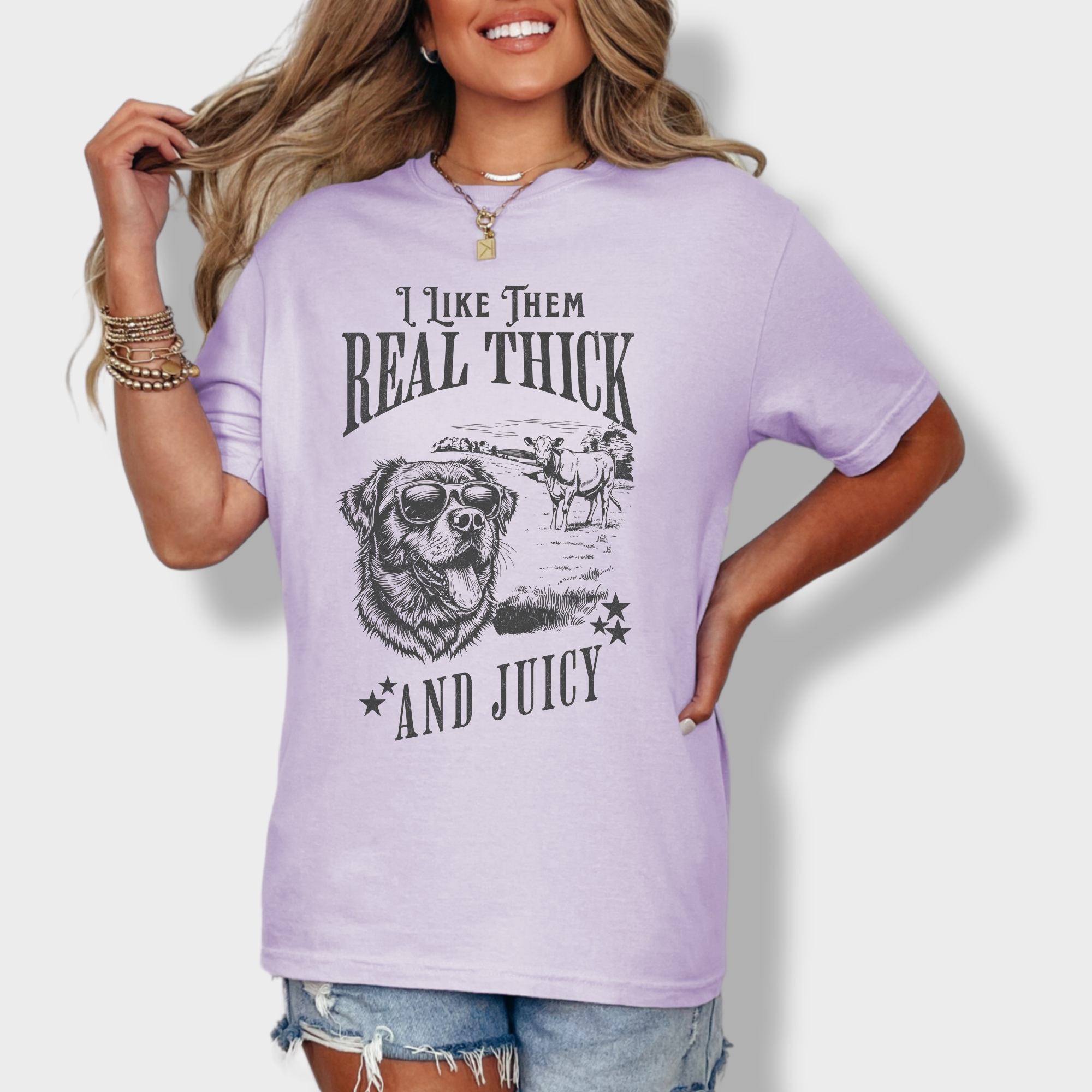 Soft cotton T-shirt featuring a humorous dog and cow design with the text 'I like them real thick and juicy,' inspired by classic hip-hop