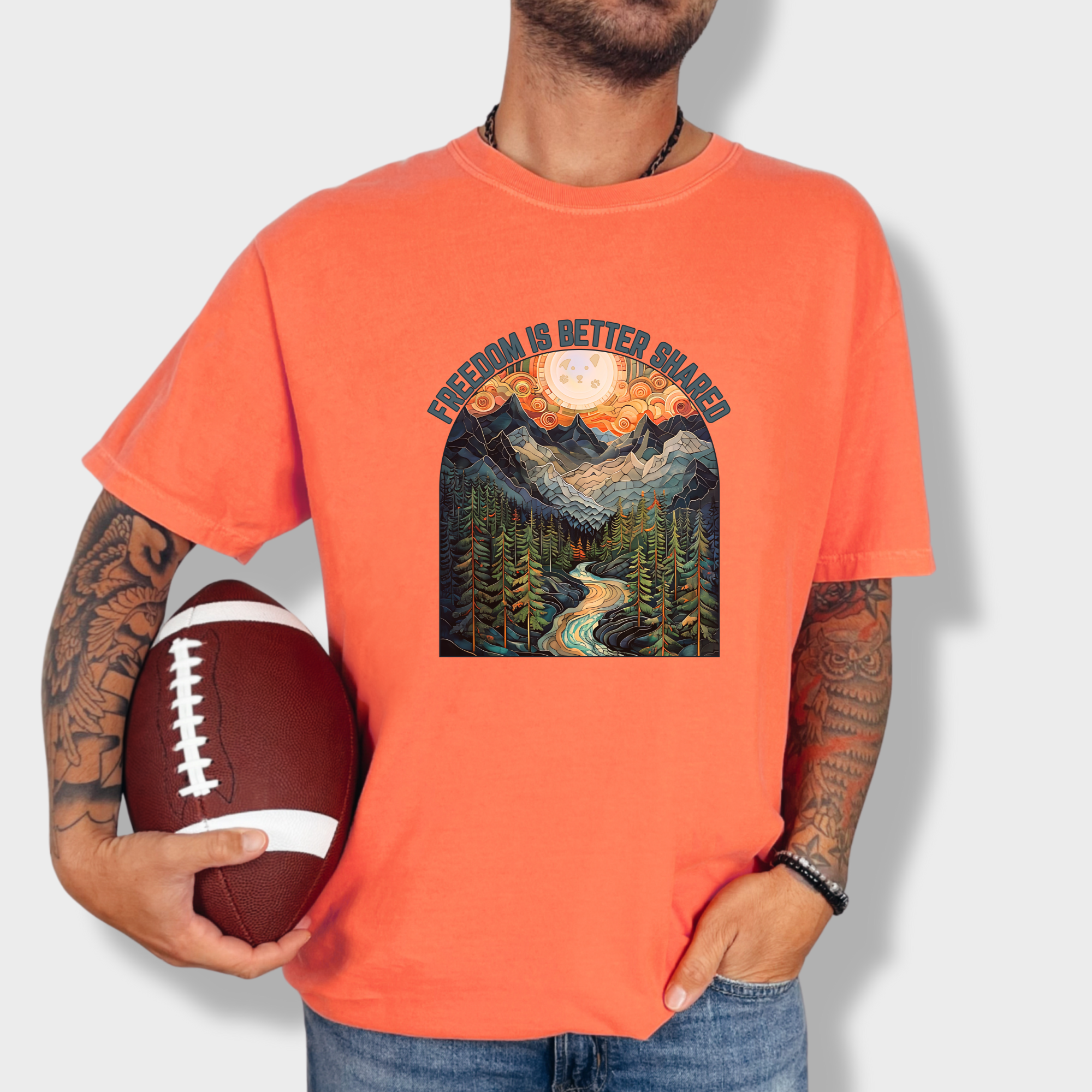 artistic-mountain-freedom-is-better-shared-stained-glass-version-dog-graphic-comfort-colors-t-shirt-in-bright-salmon - Bright Salmon Lifestyle Male Model