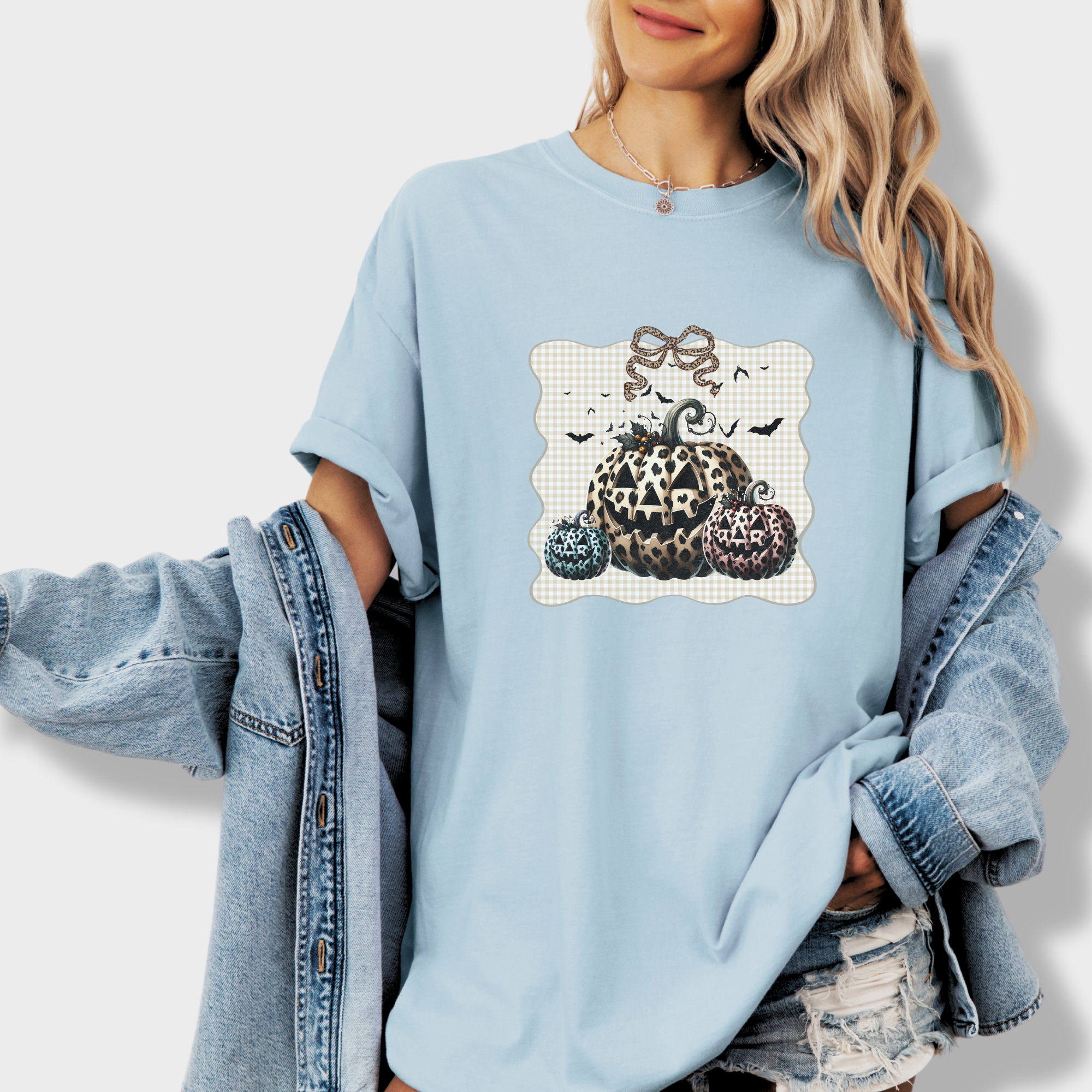 western-preppy-leopard-print-jack-o-lanterns-cat-bow-comfort-colors-t-shirt-in-chambray - Chambray Lifestyle Female Model