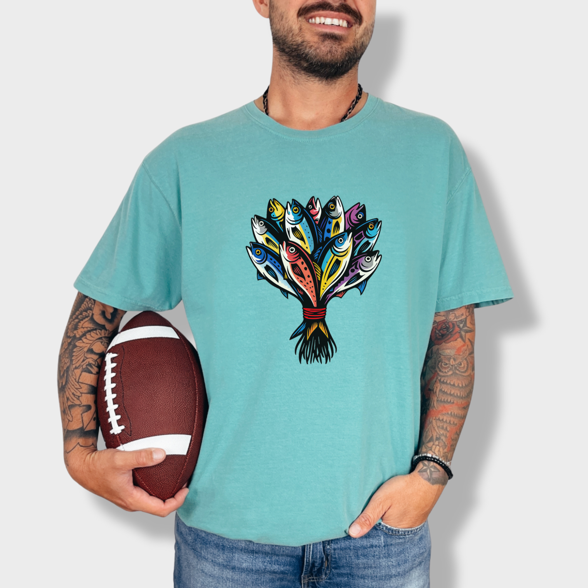 artistic-fish-bouquet-a-cats-dream-cat-graphic-comfort-colors-t-shirt-in-seafoam - Seafoam Lifestyle Male Model