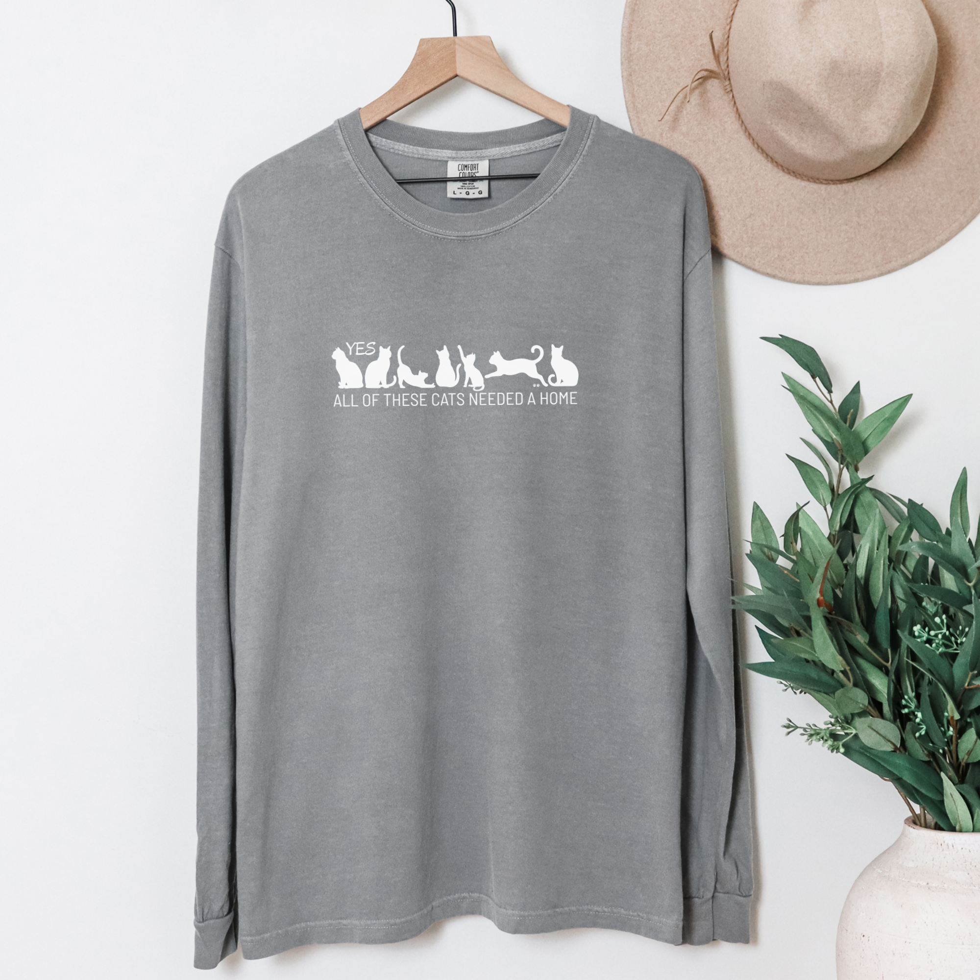fetch-n-found unisex tee for men and women featuring , Yes all of these cats needed a home Grey graphic T-Shirt made of 100% cotton - Grey Hanging Front
