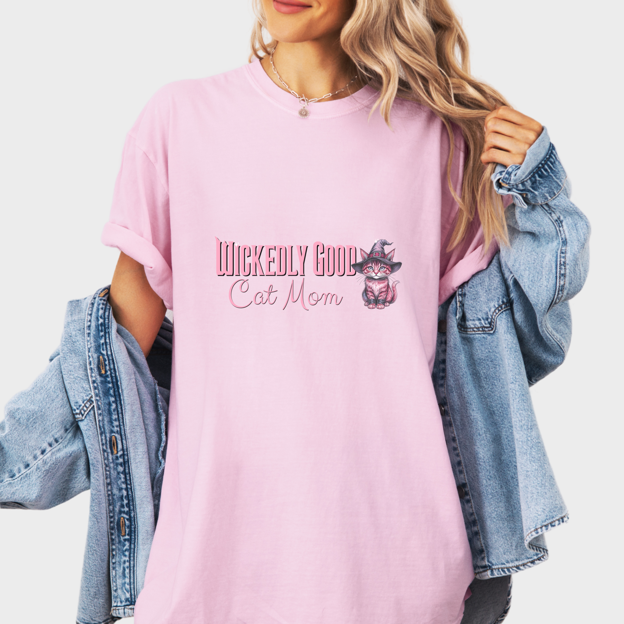 movie-inspired-pink-wickedly-good-cat-mom-cat-graphic-comfort-colors-t-shirt-in-blossom - Blossom Lifestyle Female Model