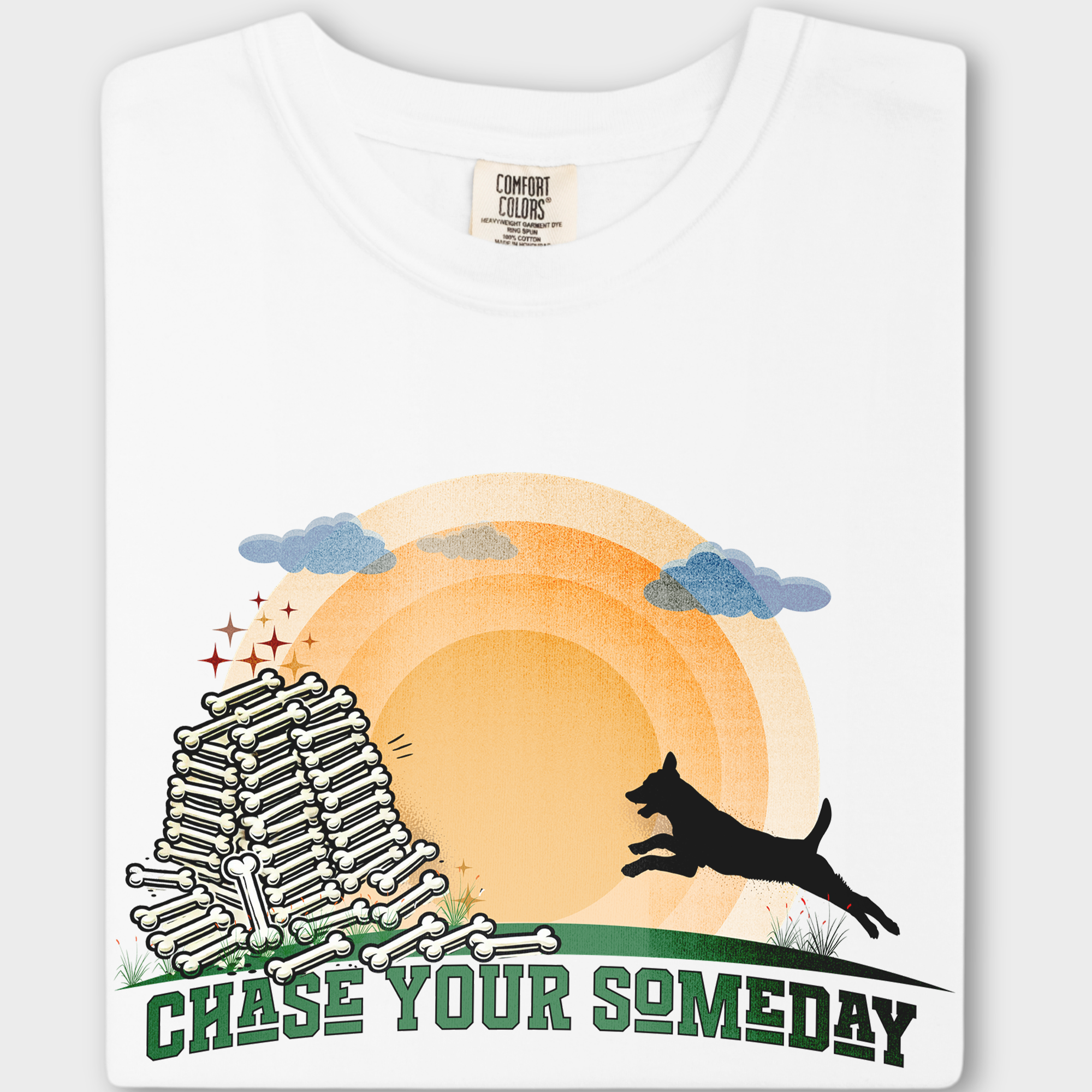 Whimsical graphic tee for dog lovers, showcasing a running pup, golden sun, and the uplifting message 'Chase Your Someday'.