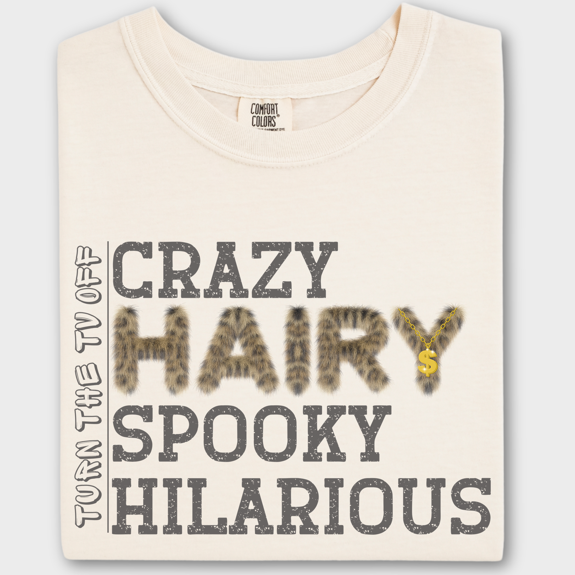 Funny hip-hop inspired T-shirt featuring the phrase 'Crazy Hairy Spooky Hilarious' in a fur-textured font with a gold chain detail.