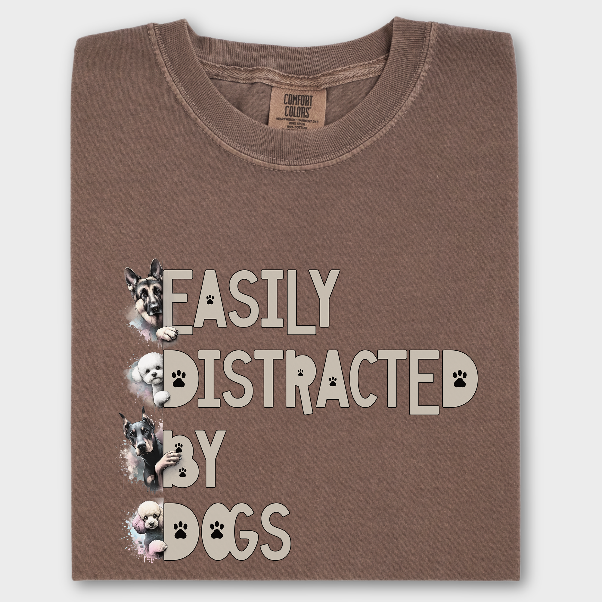 Unique graphic tee with 'Easily Distracted by Dogs' in an eye-catching font, accented by watercolor paintings of four dog breeds.