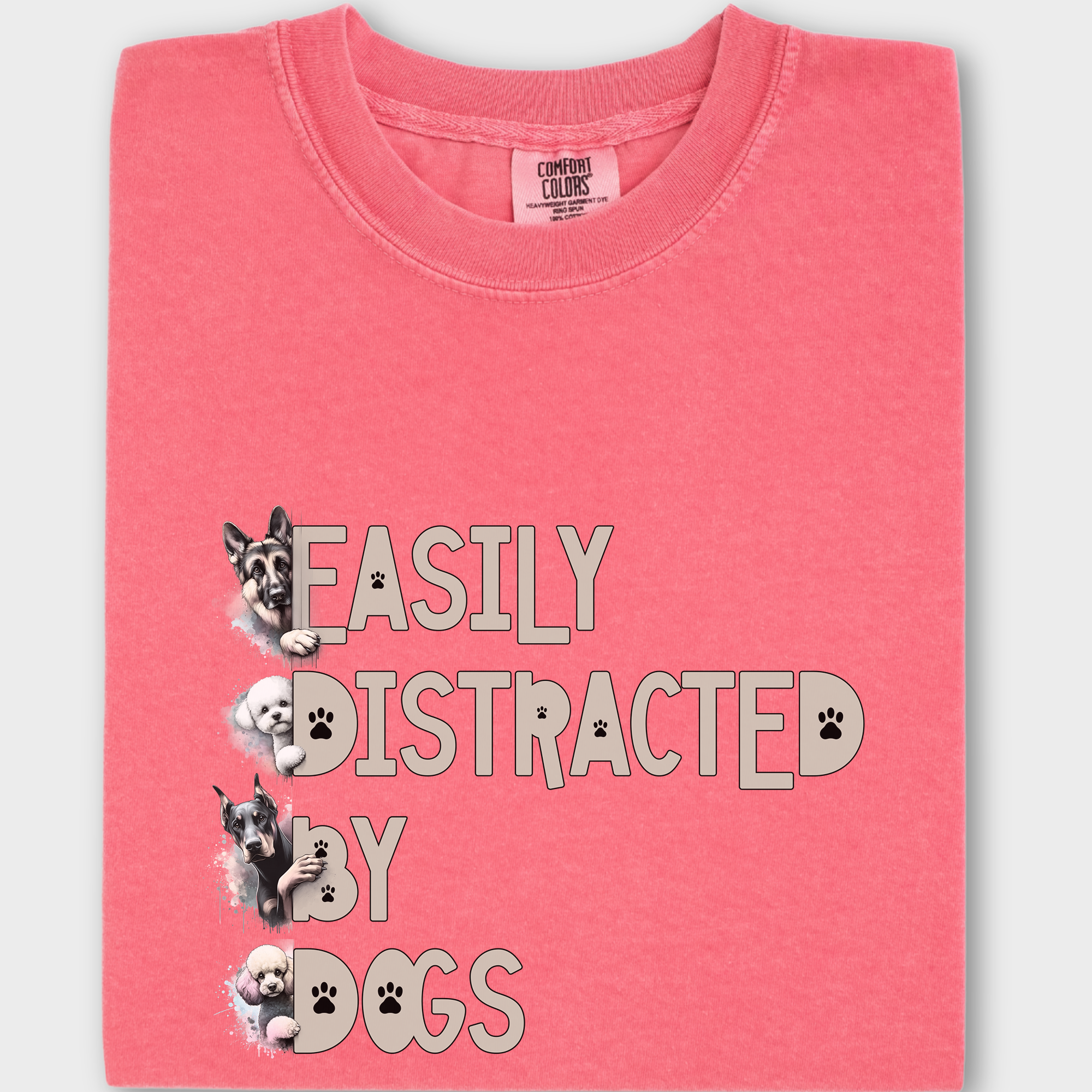 Unique graphic tee with 'Easily Distracted by Dogs' in an eye-catching font, accented by watercolor paintings of four dog breeds.