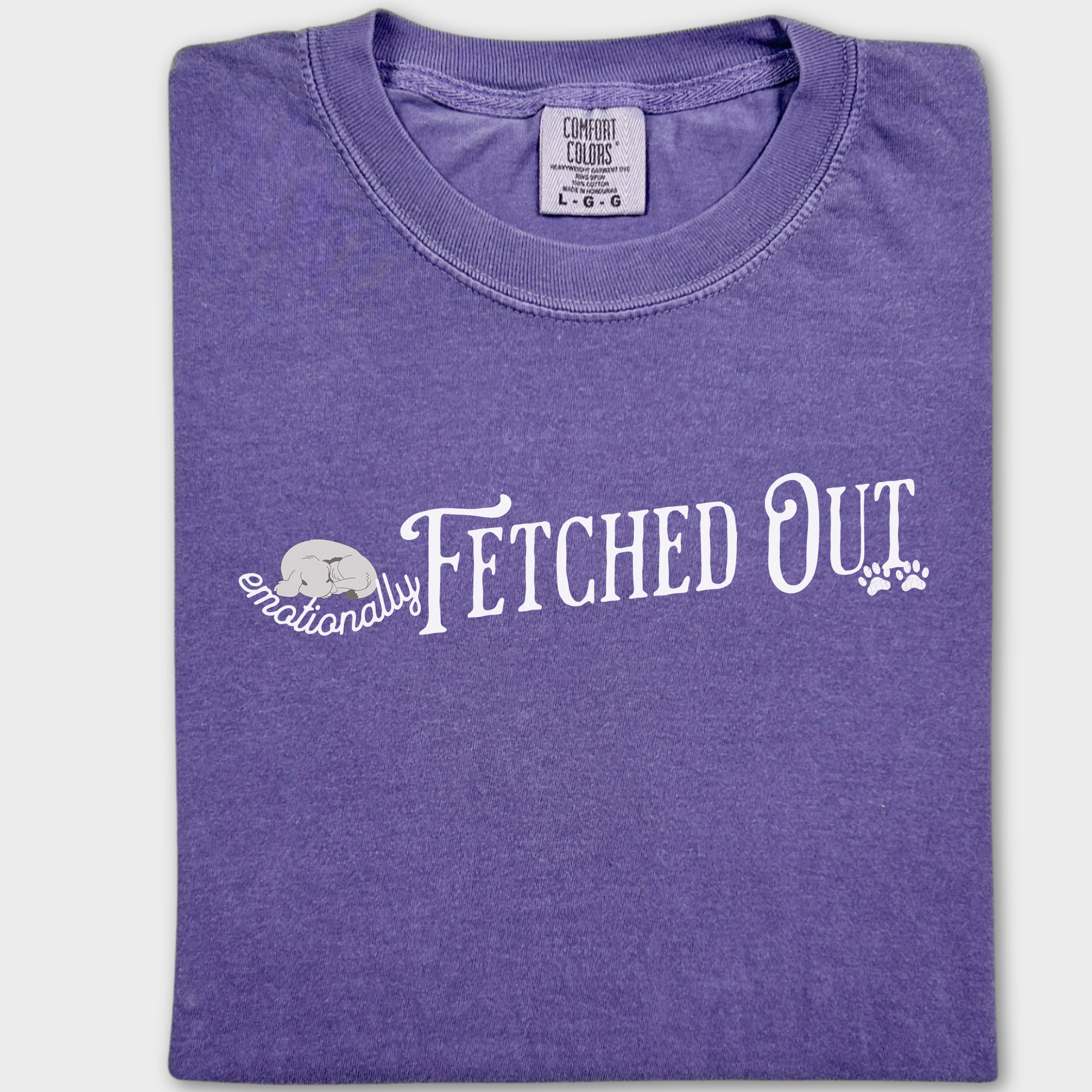 Funny dog lover’s T-shirt with the witty phrase 'Emotionally Fetched Out,' perfect for exhausted pet parents.