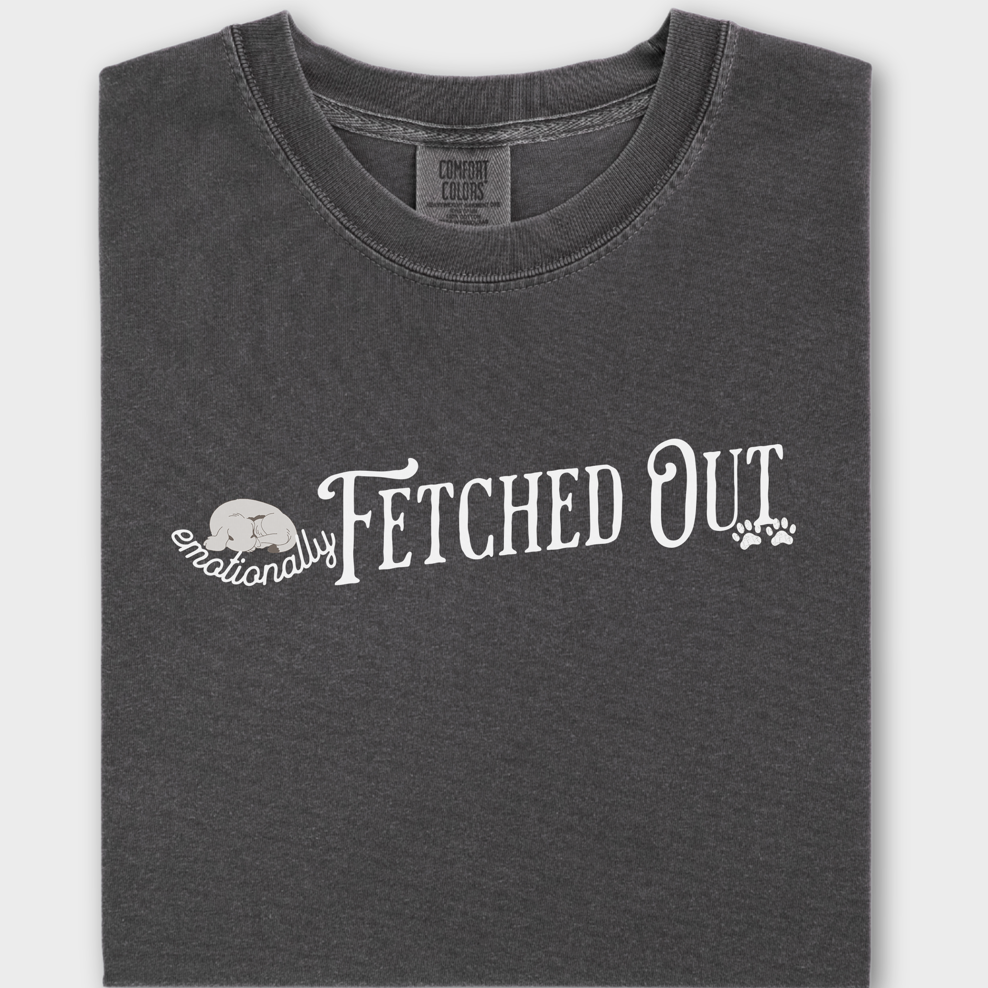Funny dog lover’s T-shirt with the witty phrase 'Emotionally Fetched Out,' perfect for exhausted pet parents.