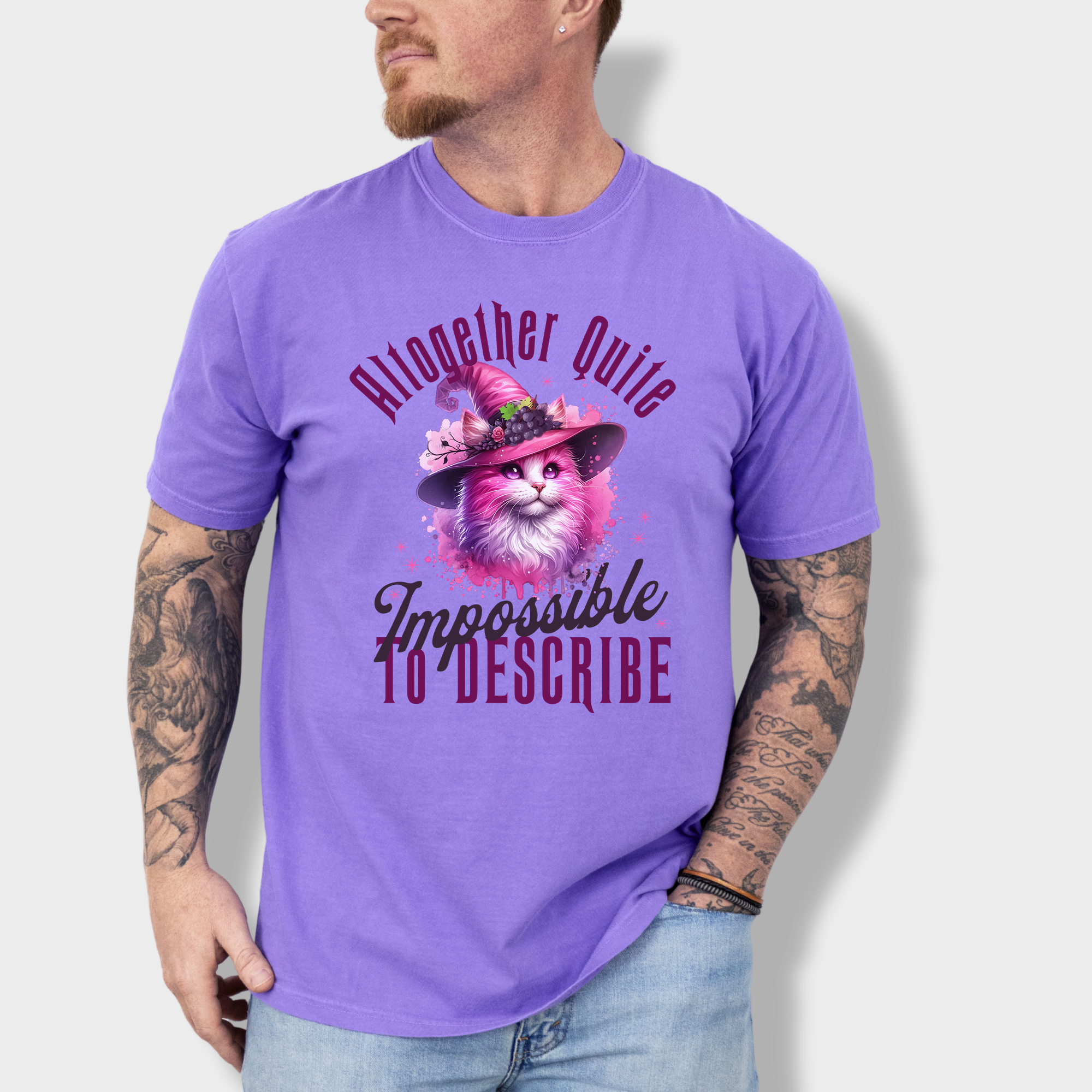 Elegant feline witch T-shirt featuring a pink watercolor cat in a mystical hat, with a poetic phrase from Wicked.