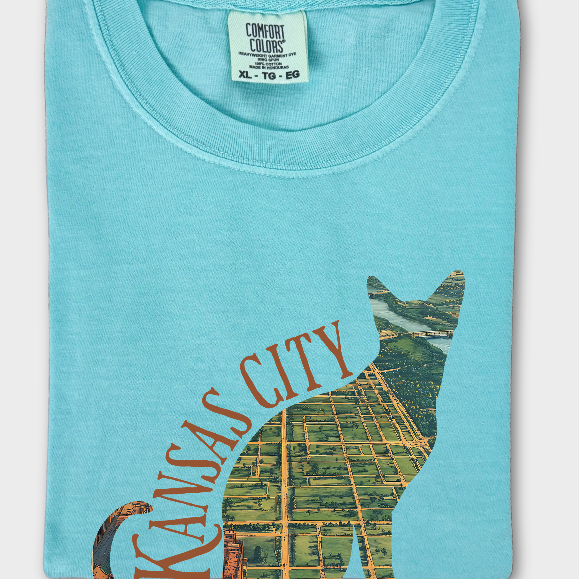 Unique T-shirt featuring a vintage satellite map of Kansas City, Missouri, framed within a bold cat silhouette design.