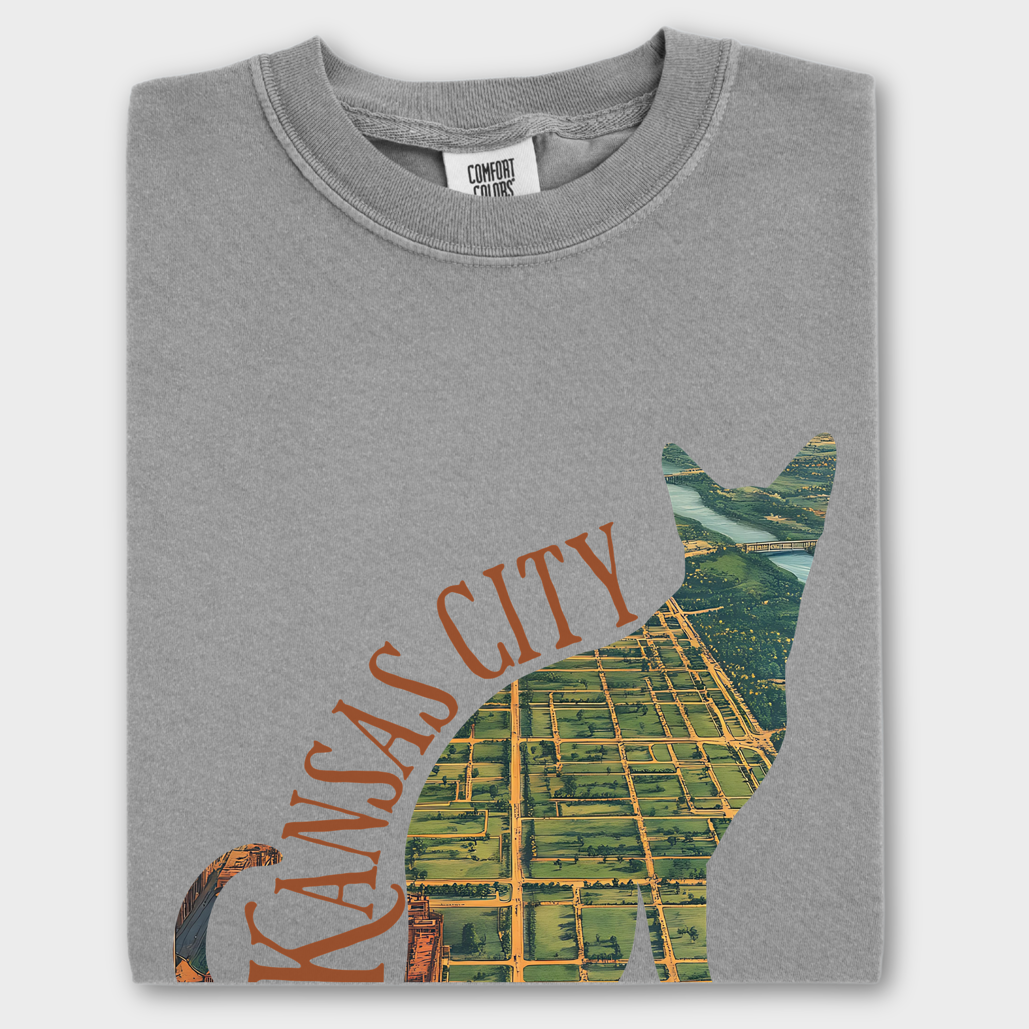 Unique T-shirt featuring a vintage satellite map of Kansas City, Missouri, framed within a bold cat silhouette design.