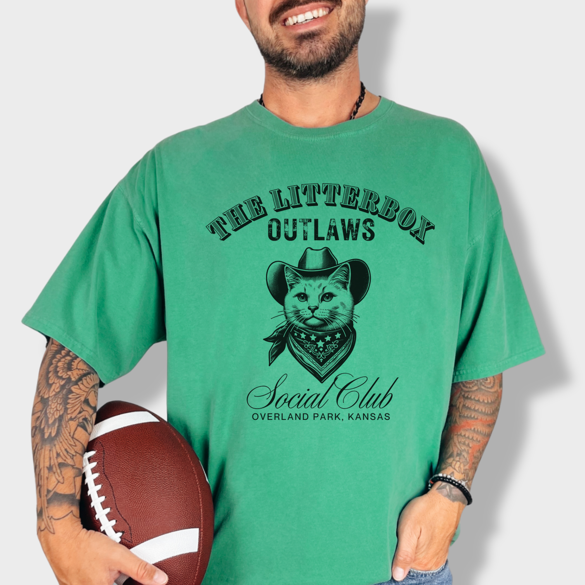Funny outlaw cat graphic tee with a cowboy-hat-wearing feline and a customizable 'Litterbox Outlaws Social Club' location.