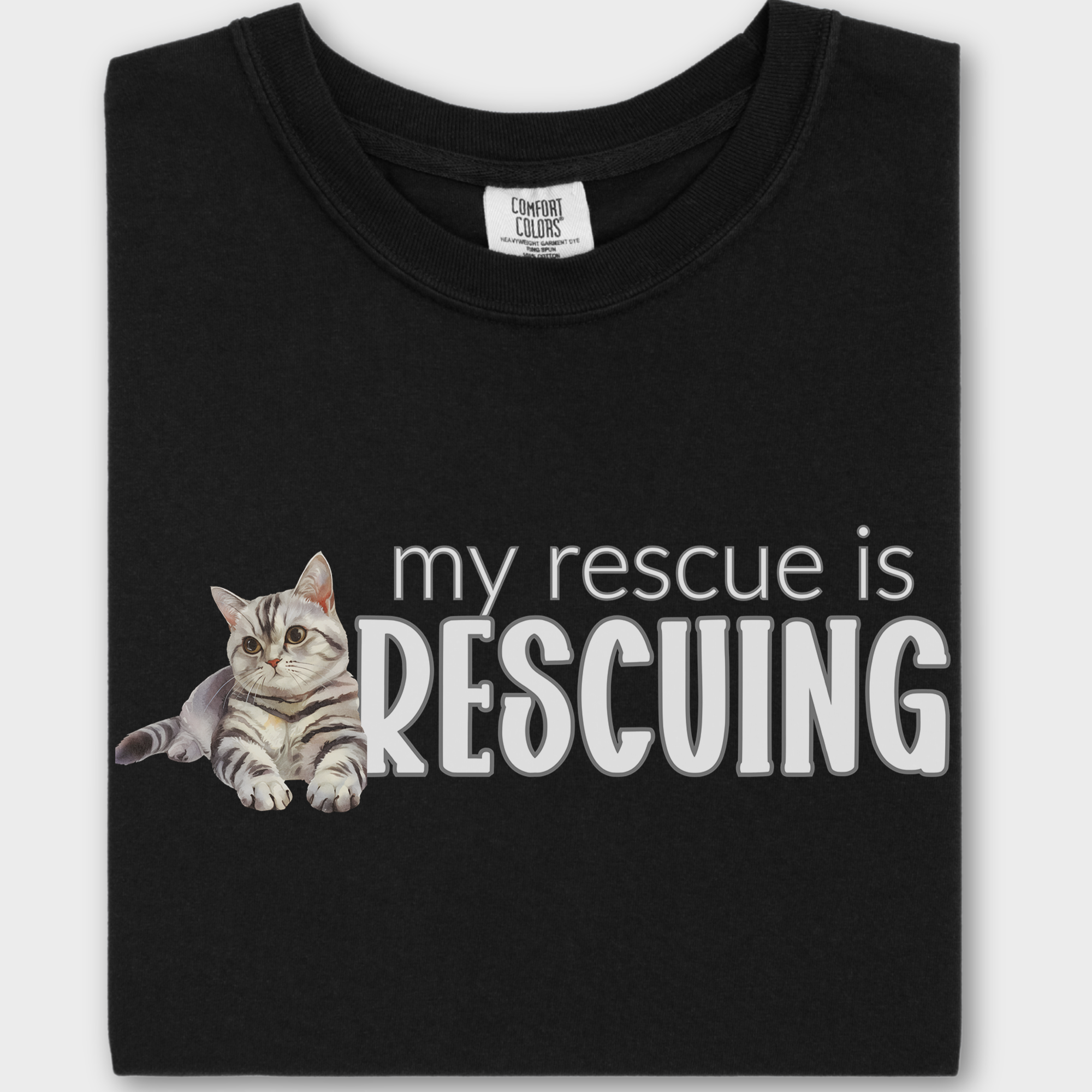 Soft cotton cat T-shirt showcasing a beautiful watercolor rescue cat illustration with a meaningful pet lover’s phrase.