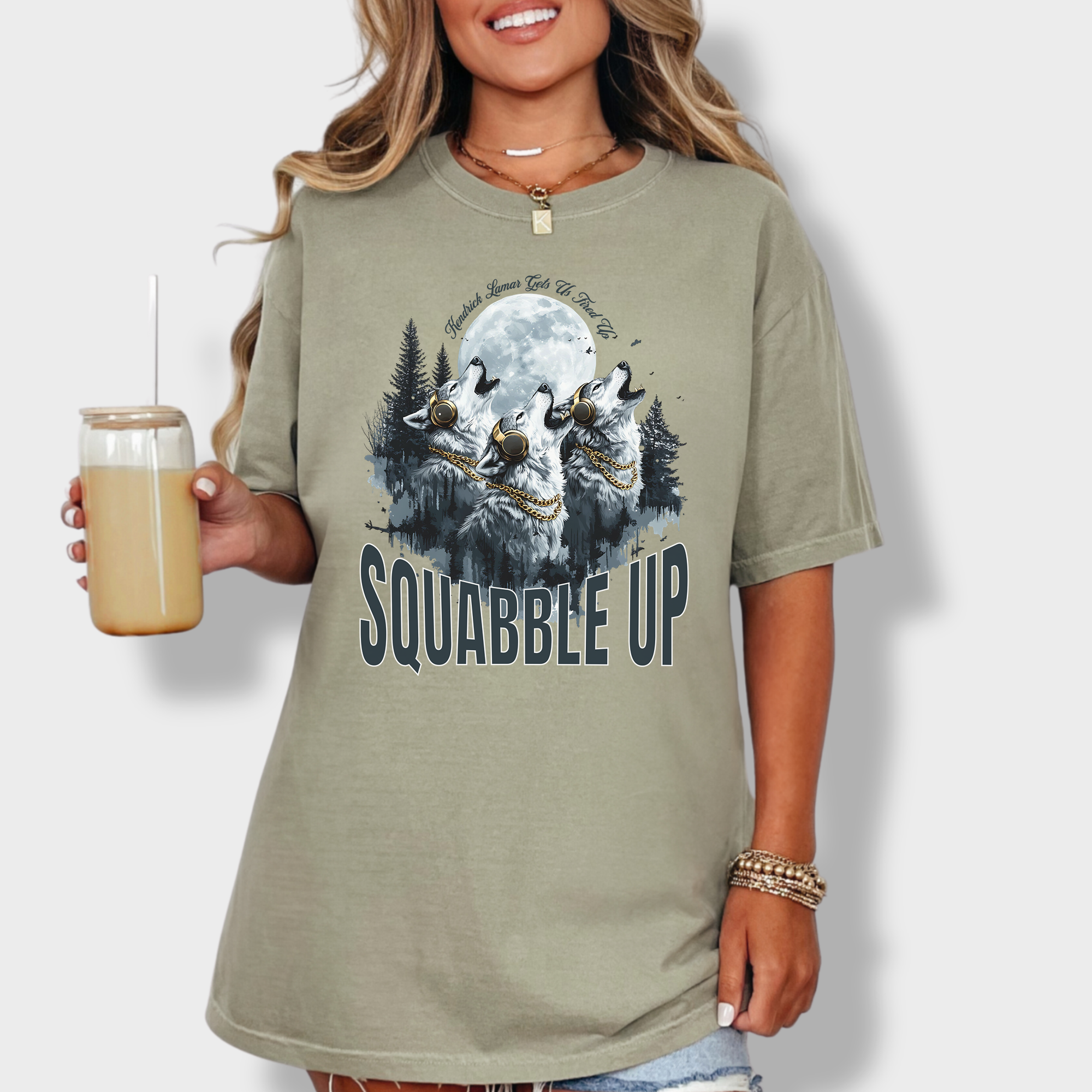 Retro-style wolf tee with a pack of howling wolves in headphones and bold 'Squabble Up' lettering, perfect for hip-hop and nature lovers.