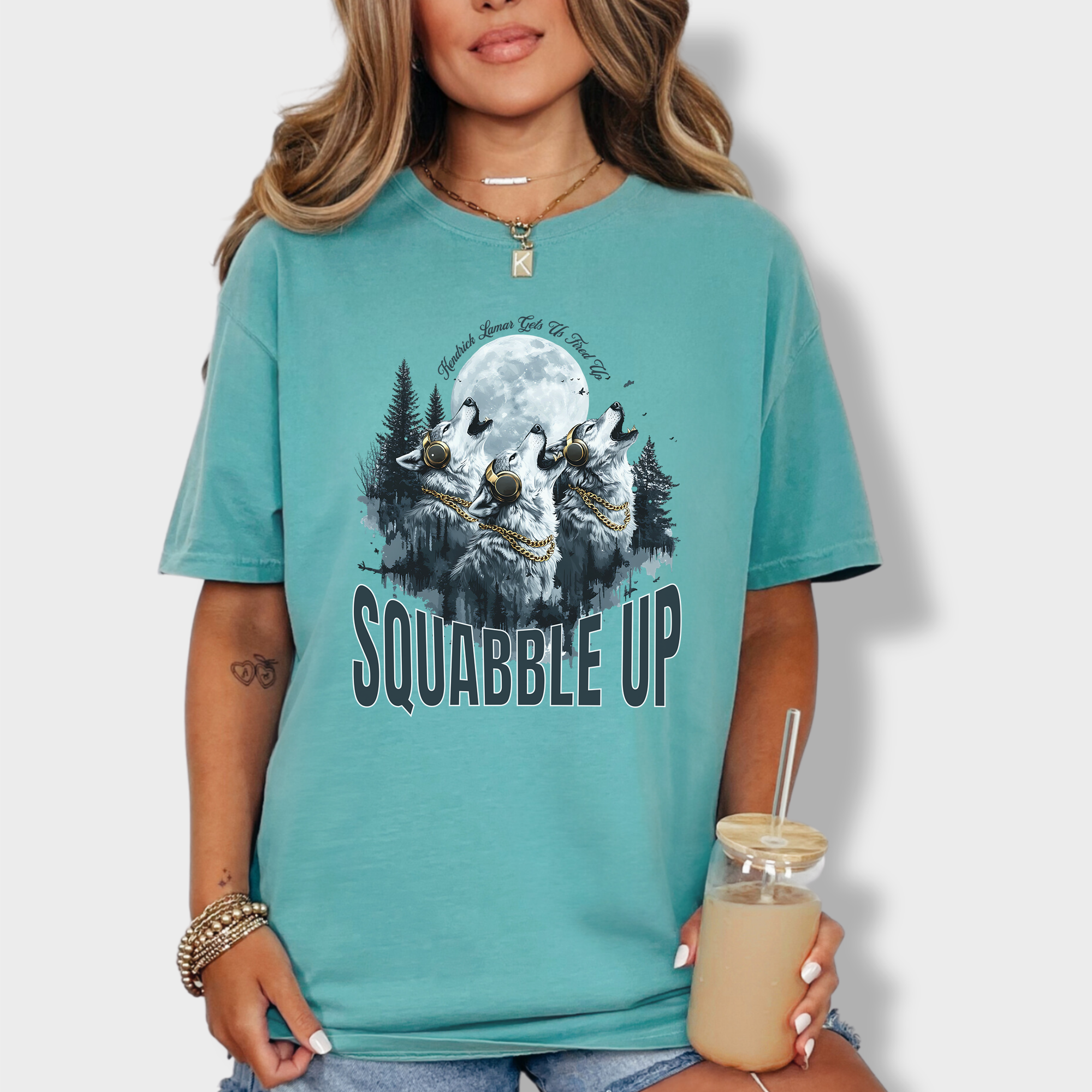 Retro-style wolf tee with a pack of howling wolves in headphones and bold 'Squabble Up' lettering, perfect for hip-hop and nature lovers.