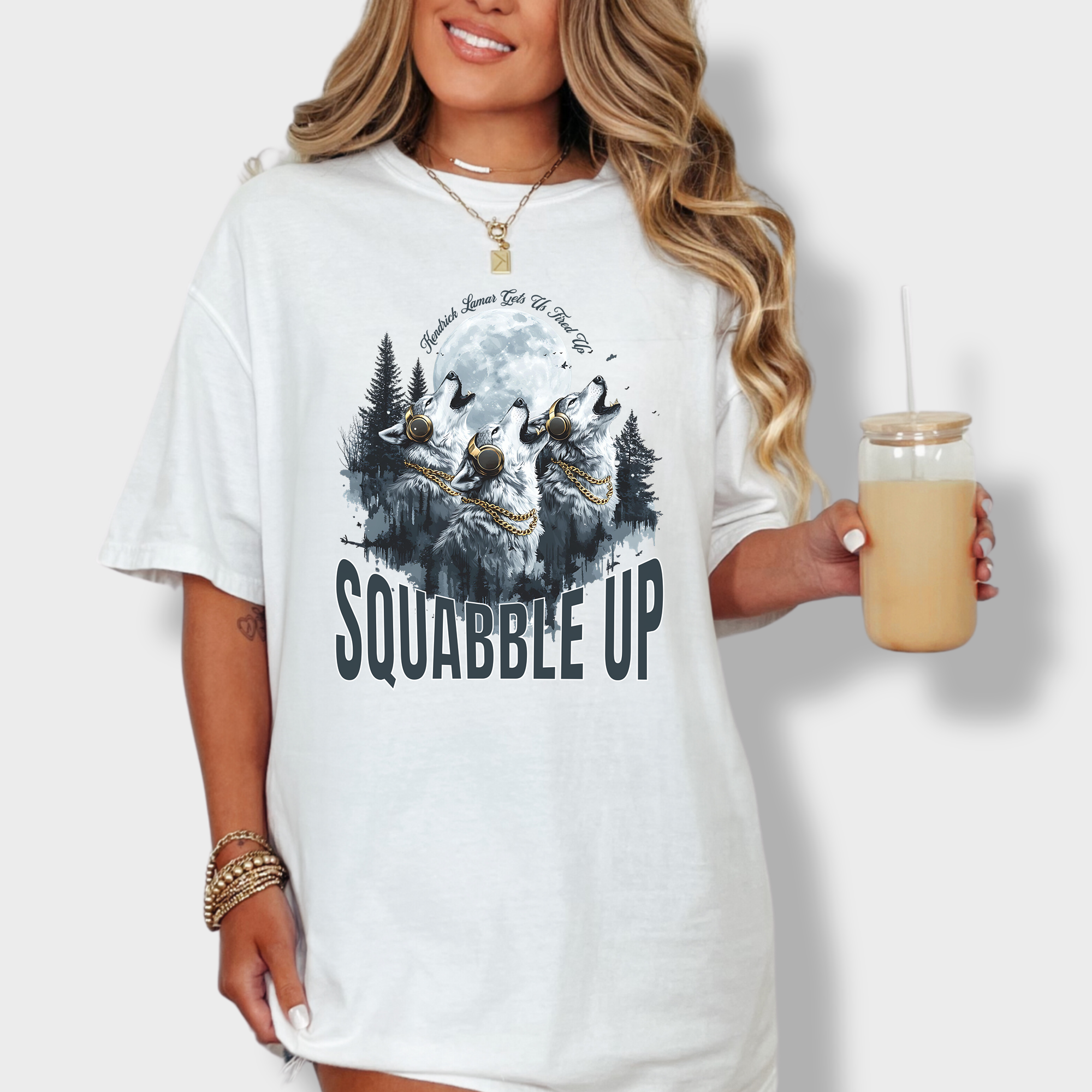 Bold wolf-themed T-shirt with 'Squabble Up' text, a howling pack wearing headphones, and a nod to Kendrick Lamar's fiery energy.