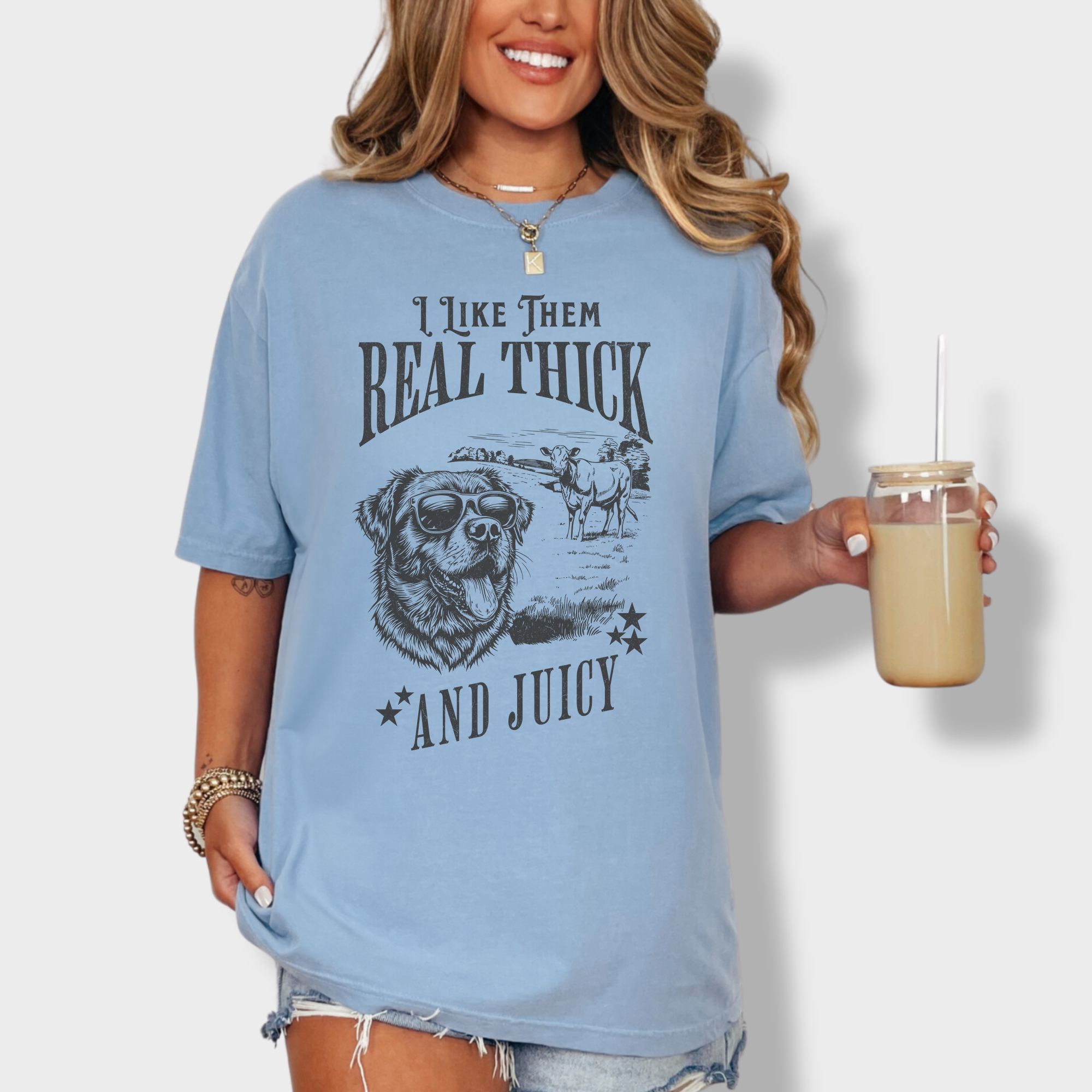 Minimalist line-art dog and cow graphic tee with humorous text, nodding to 90s hip-hop lyrics.