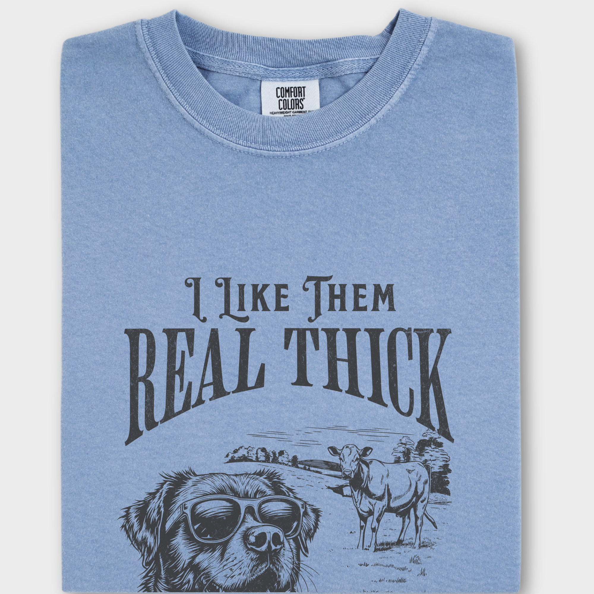 Retro-style dog T-shirt featuring a cool sunglasses-wearing dog, a cow in the background, and a funny hip-hop-inspired quote