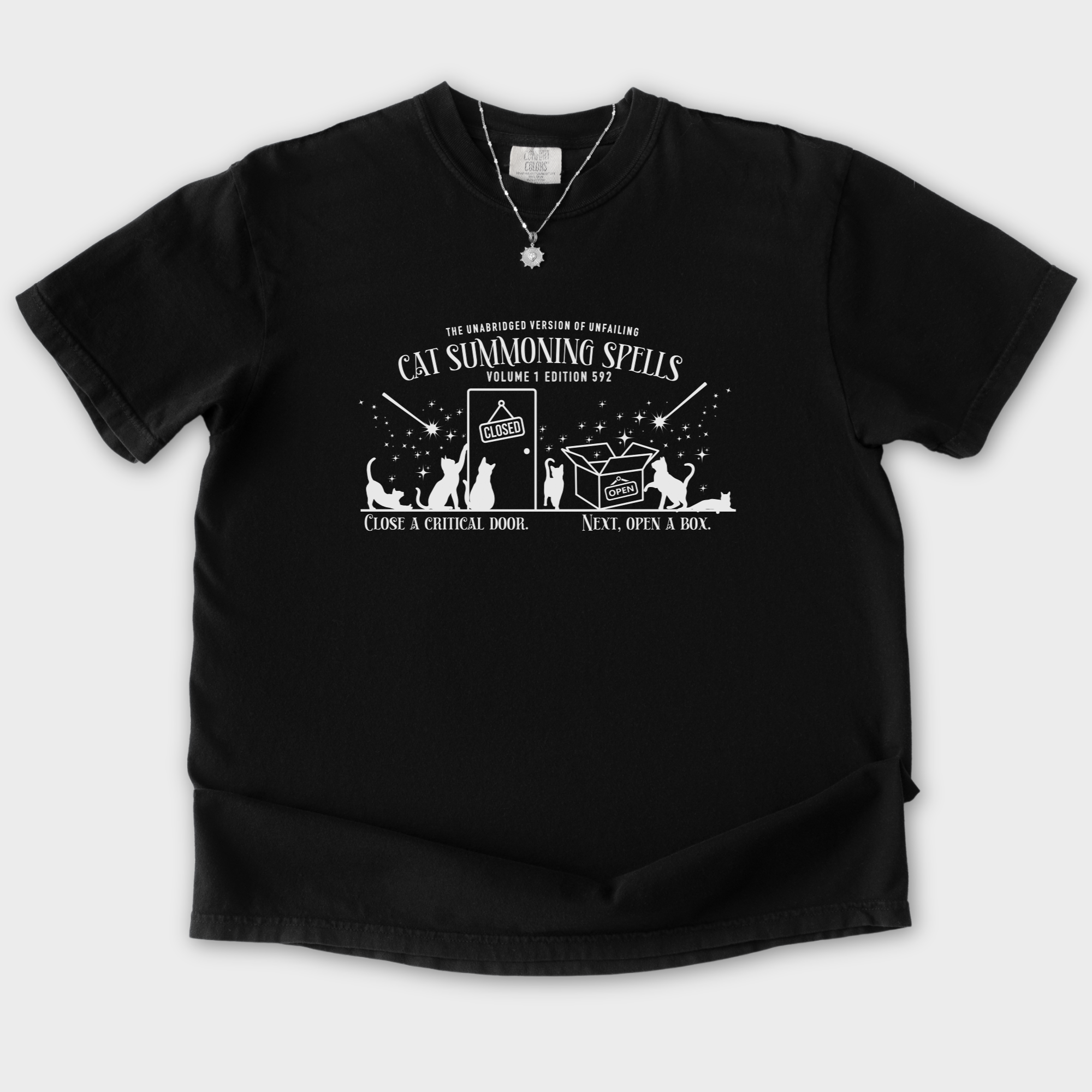 cat-summoning-spells-t-shirt-in-black - Black Flat Lay Front