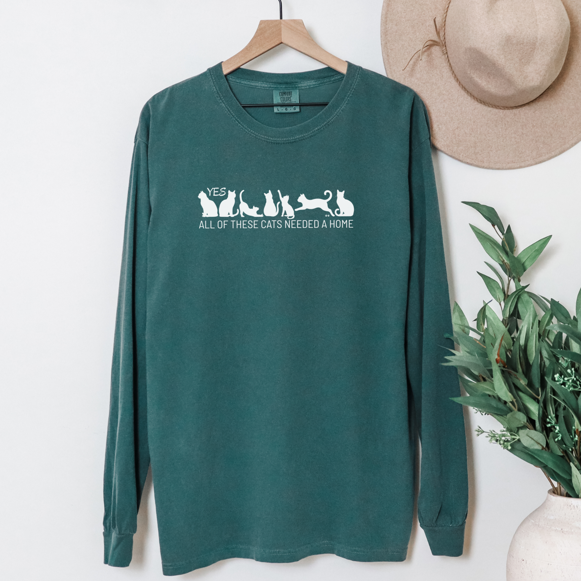 fetch-n-found  unisex tee for men and women featuring , Yes all of these cats needed a home Blue Spruce graphic T-Shirt made of 100% cotton - Blue Spruce Hanging Front