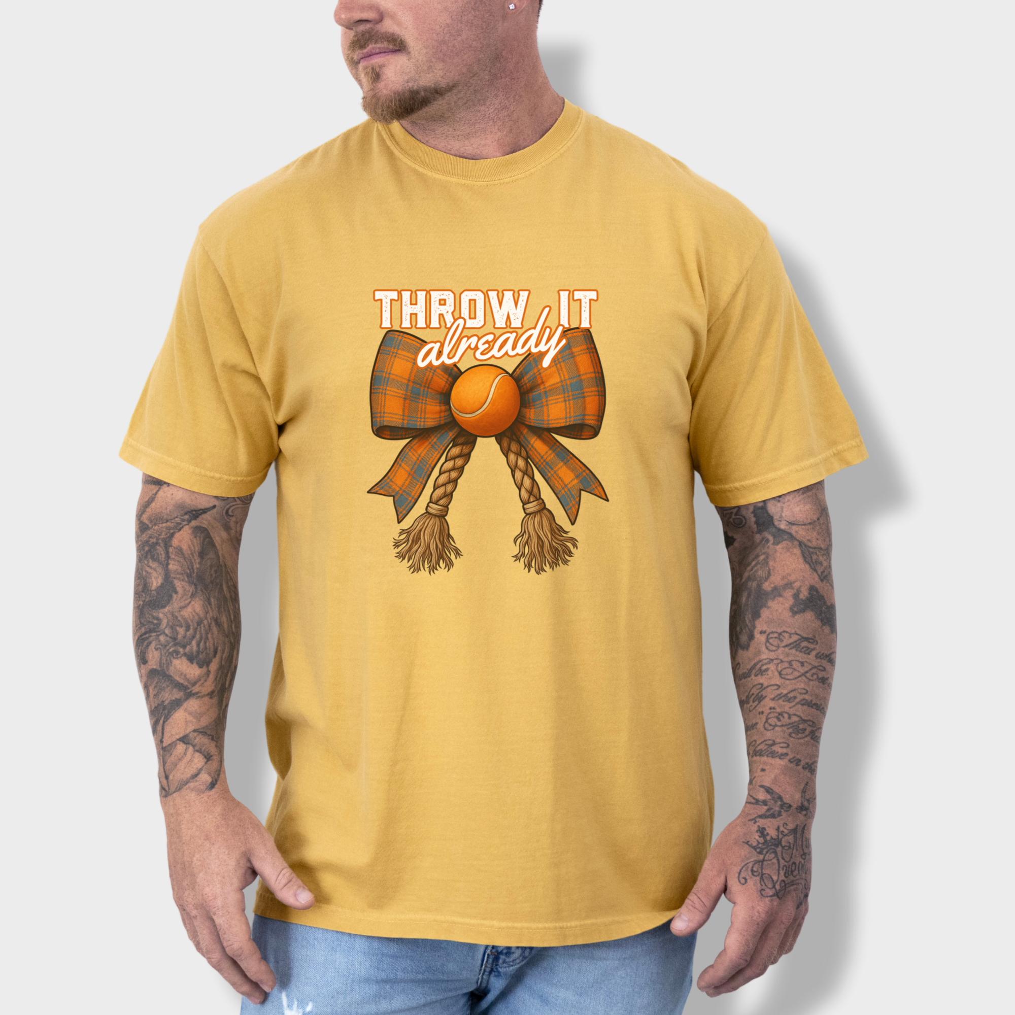 western-throw-it-already-dog-chew-toy-bow-dog-bow-comfort-colors-t-shirt-in-mustard - Mustard Lifestyle Male Model