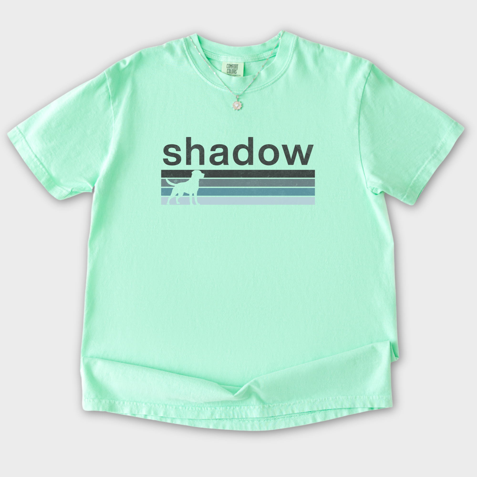 retro-dog-shadow-dog-text-comfort-colors-t-shirt-in-island-reef - Island Reef Flat Lay Front
