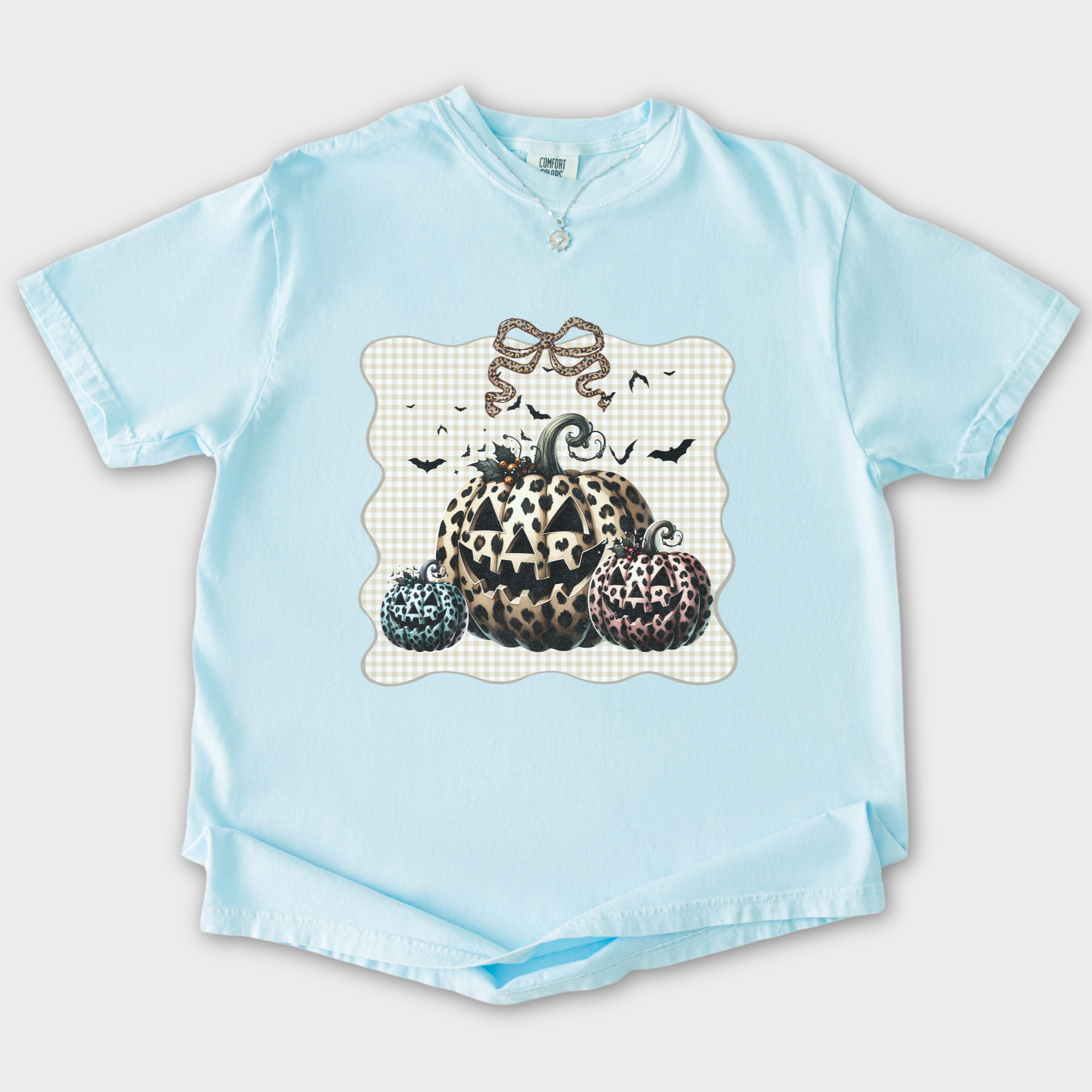 western-preppy-leopard-print-jack-o-lanterns-cat-bow-comfort-colors-t-shirt-in-chambray - Chambray Flat Lay Front