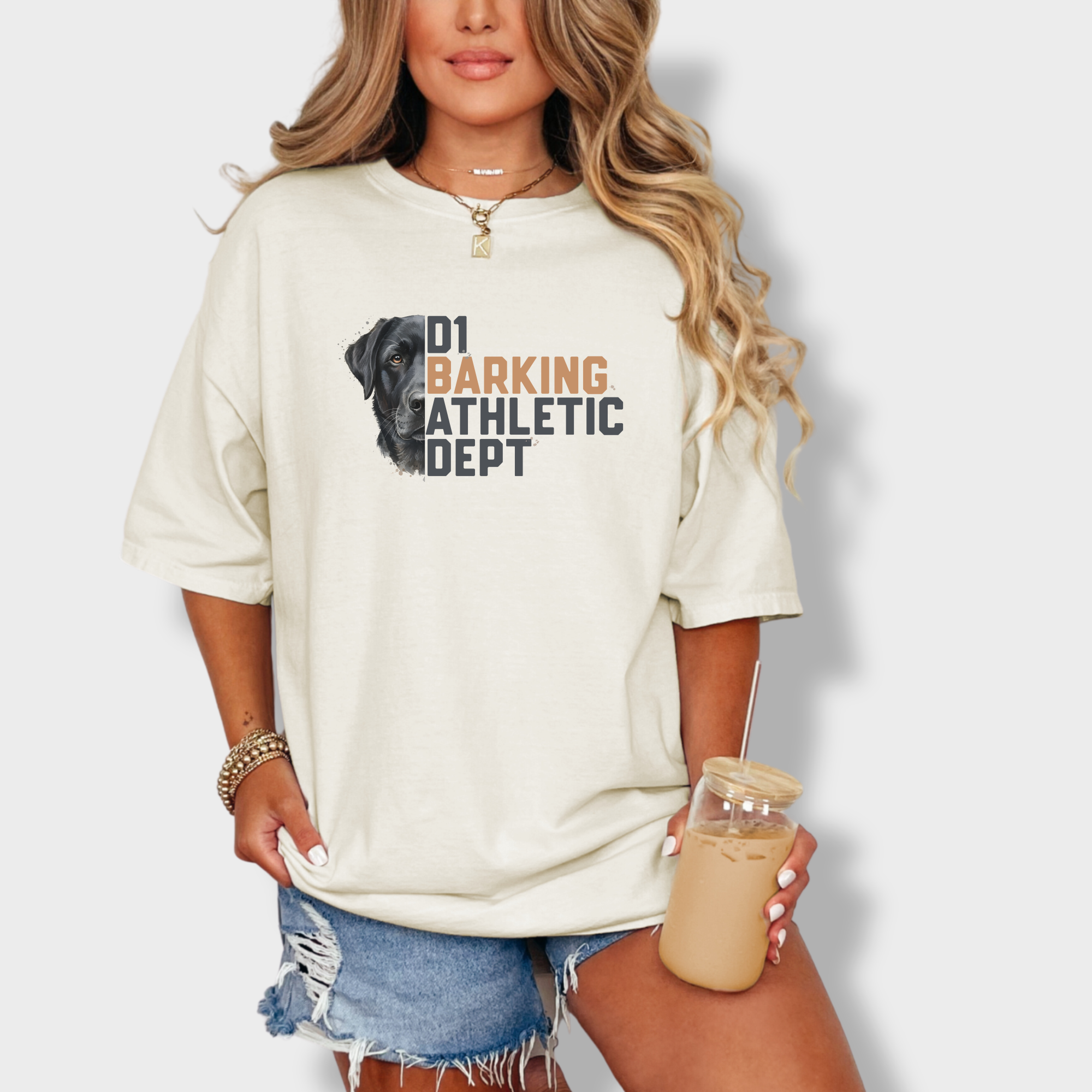 fetch-n-found  unisex tee for men and women featuring , D1 Barking Athletic Department Ivory graphic T-Shirt made of 100% cotton - Ivory Lifestyle Female Model