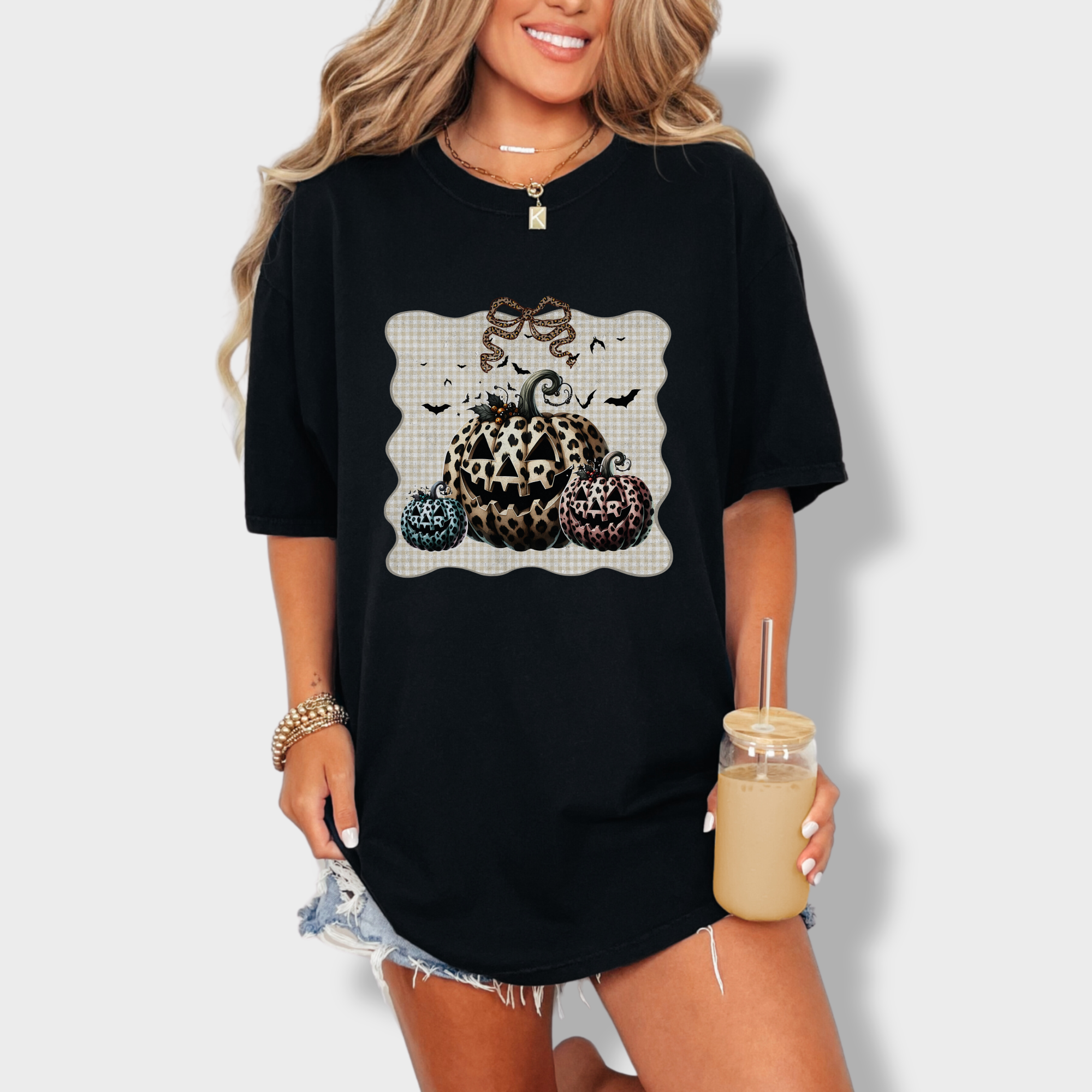 western-preppy-leopard-print-jack-o-lanterns-cat-bow-comfort-colors-t-shirt-in-black - Black Lifestyle Female Model