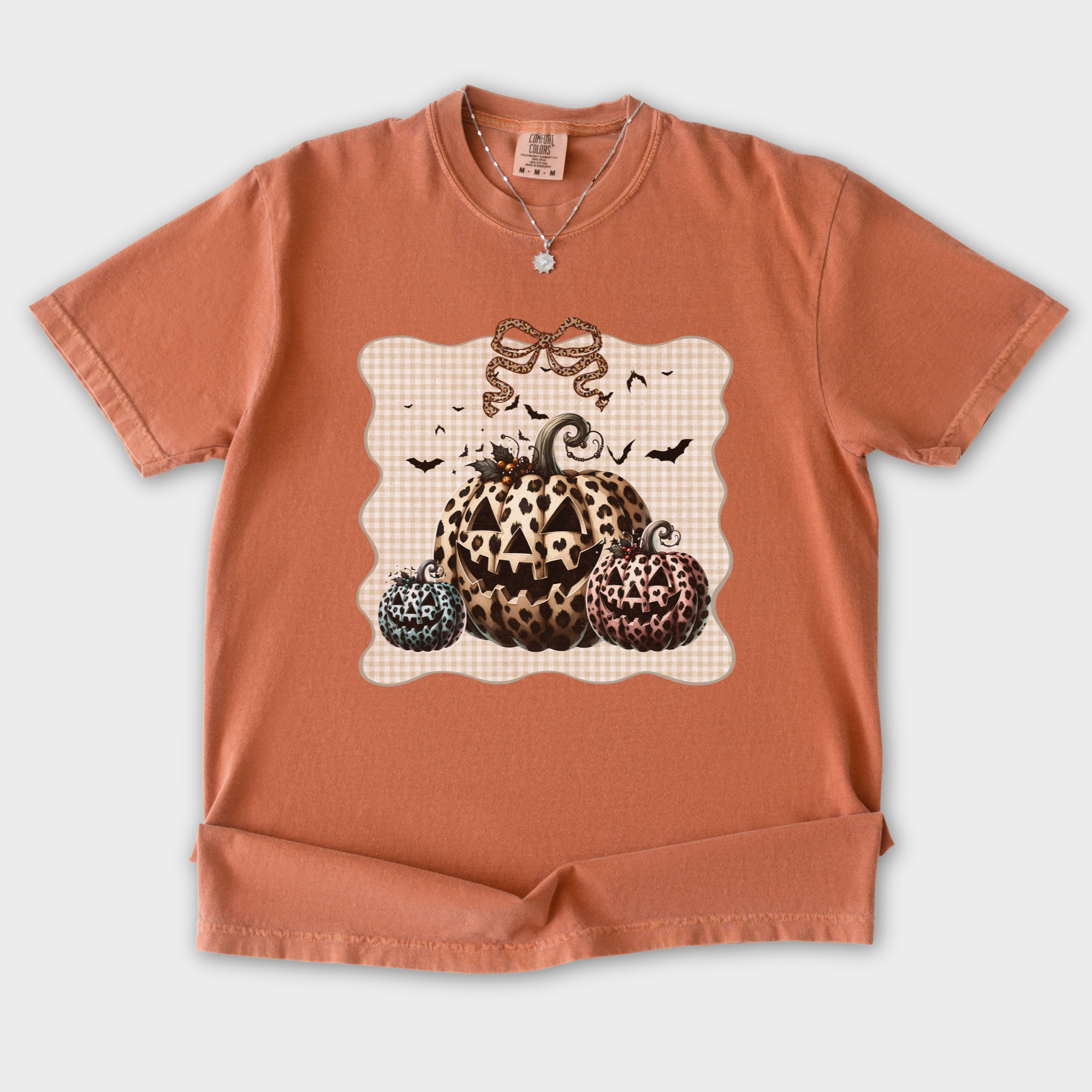 western-preppy-leopard-print-jack-o-lanterns-cat-bow-comfort-colors-t-shirt-in-yam - Yam Flat Lay Front