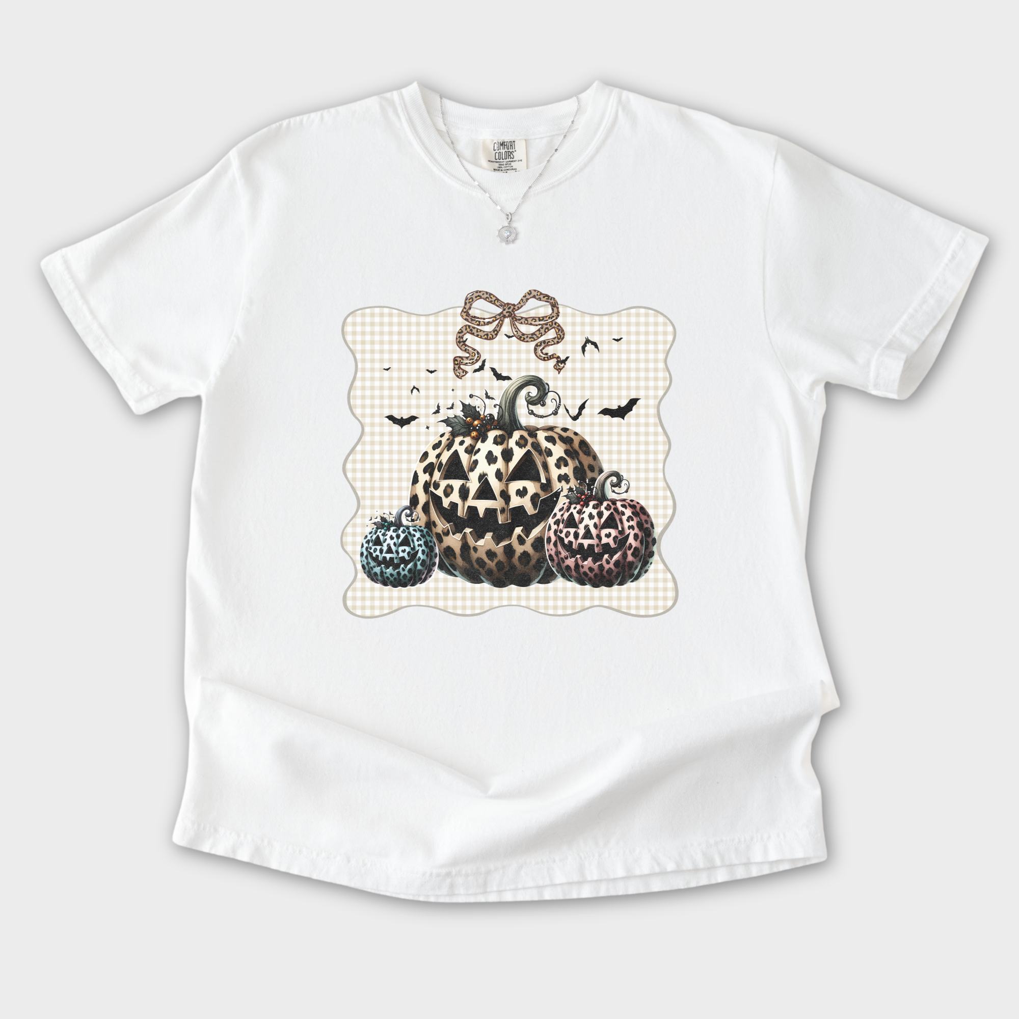 western-preppy-leopard-print-jack-o-lanterns-cat-bow-comfort-colors-t-shirt-in-white - White Flat Lay Front