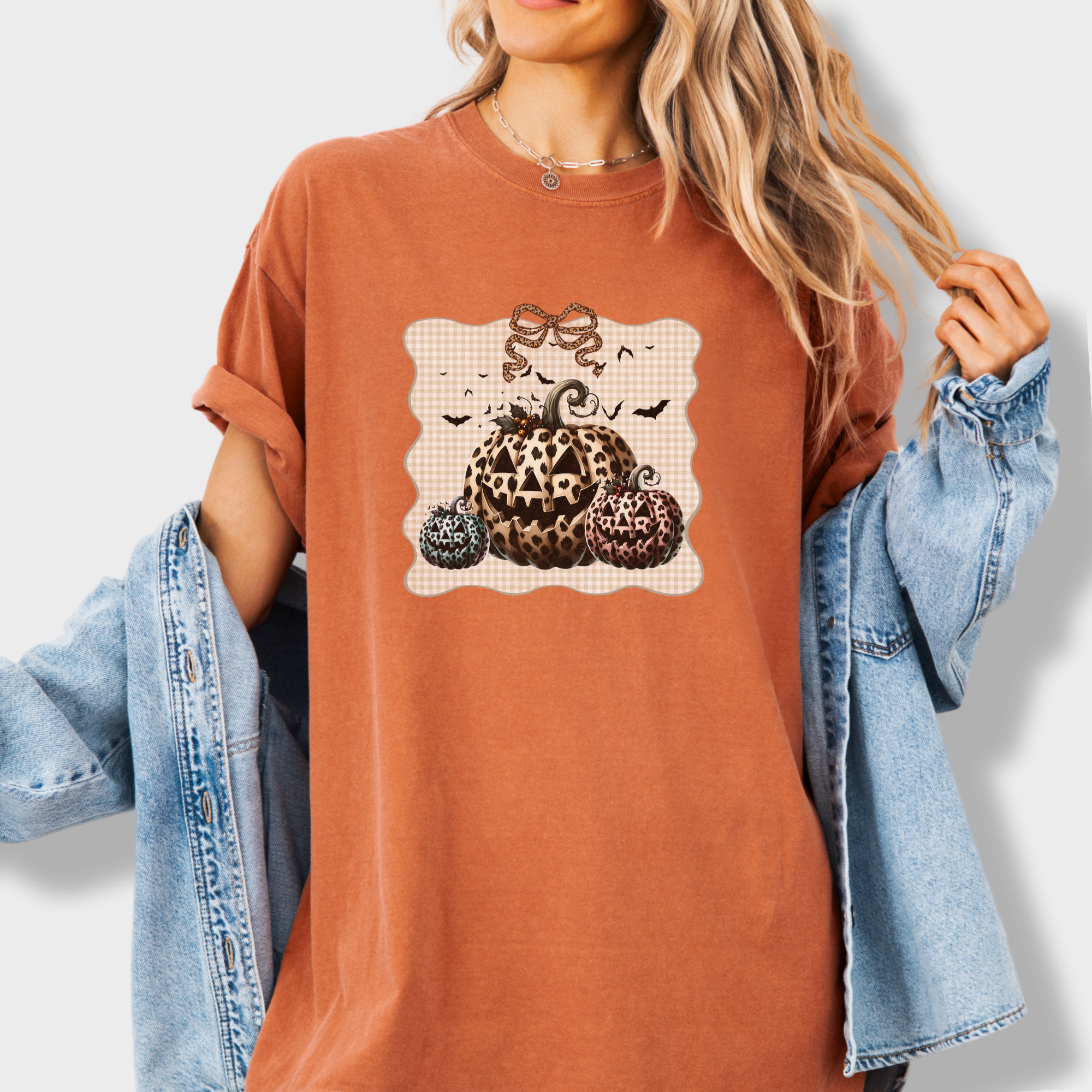 western-preppy-leopard-print-jack-o-lanterns-cat-bow-comfort-colors-t-shirt-in-yam - Yam Lifestyle Female Model