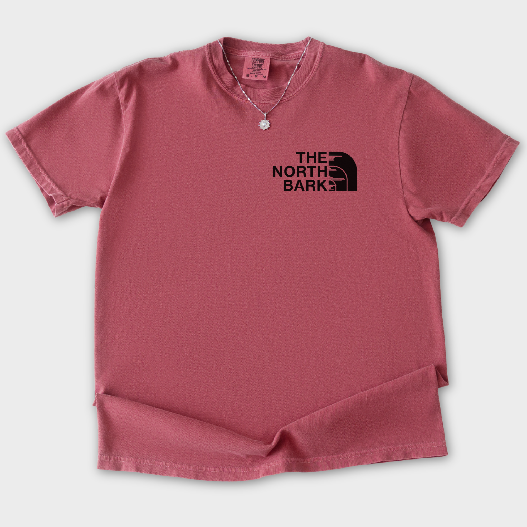 artistic-the-north-bark-dog-graphic-comfort-colors-t-shirt-in-crimson - Crimson Flat Lay Front